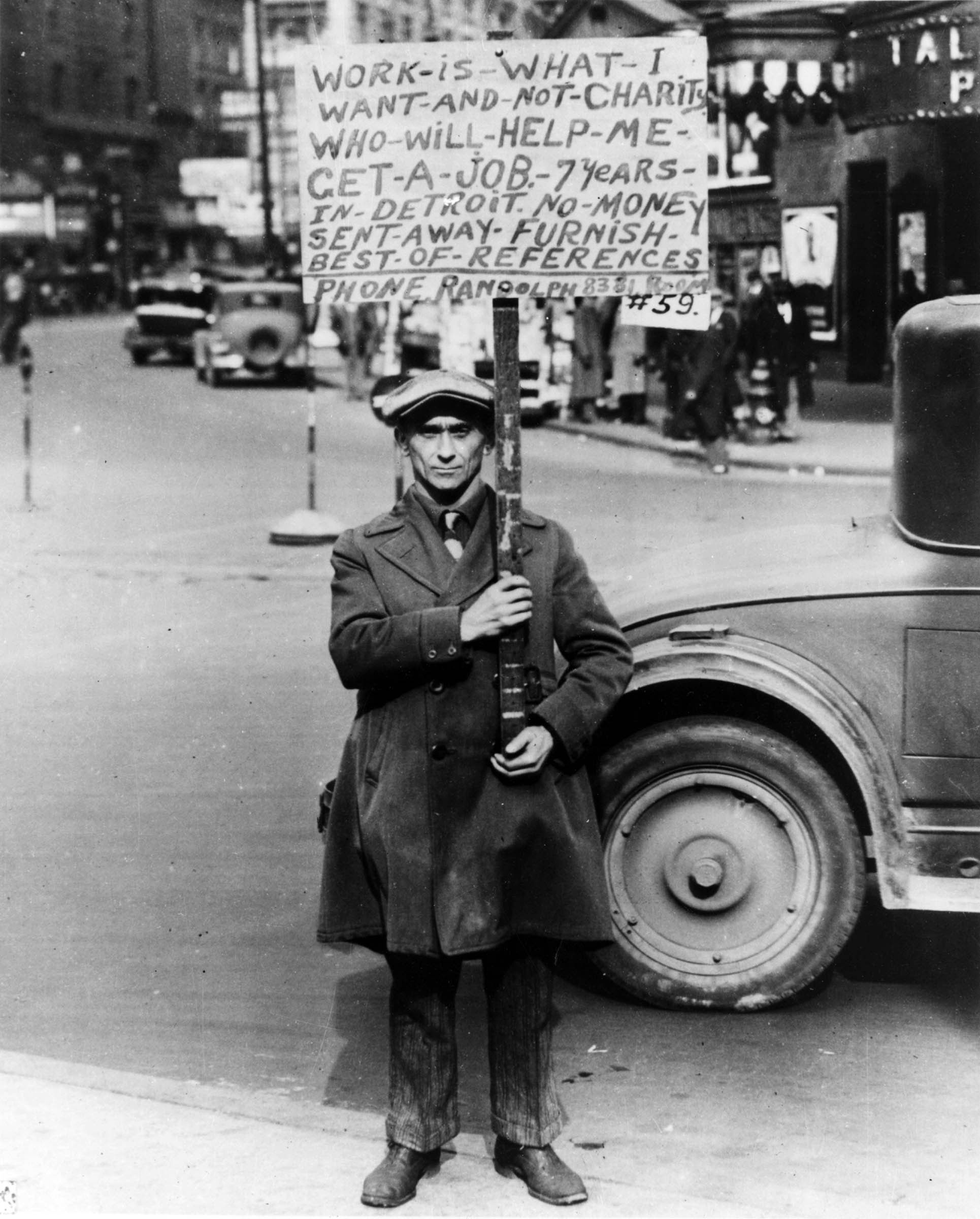 During the Depression, unemployment struck the nation’s large industrial cities with particular ferocity. In Detroit, automobile production dropped by half. Nearly one-third of all families there had no breadwinner. This unemployed worker took to the streets in search of work.