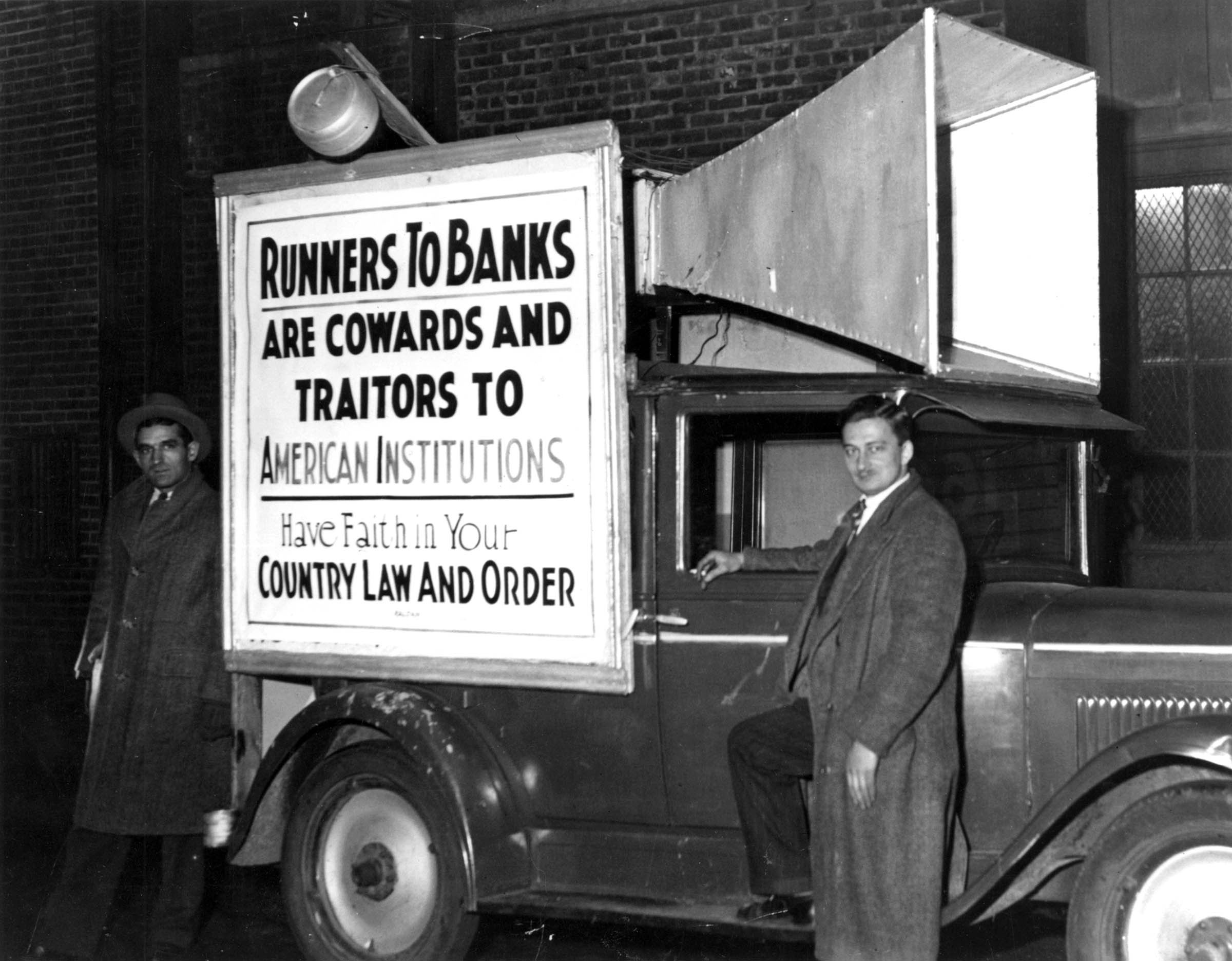 Instead of blaring its usual movie advertisement, this theater sound truck toured the streets of Boston in December 1931 to chide citizens who, fearing impending financial failure, had withdrawn their deposits from local banks.