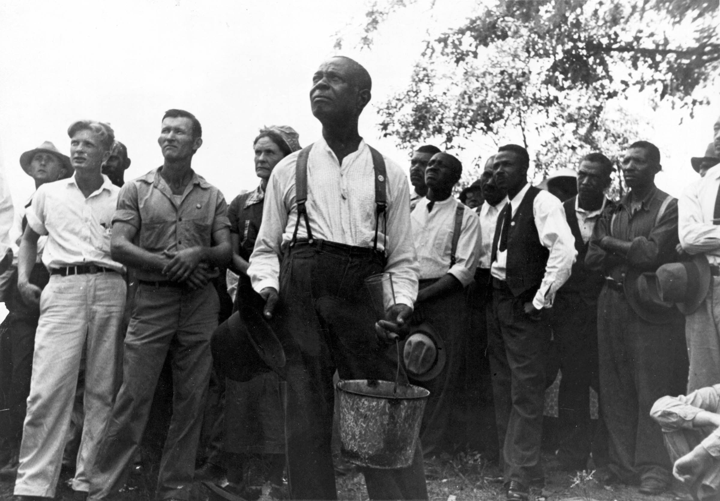 Black and white farmworkers listened to a speaker at a Southern Tenant Farmers’ Union meeting.