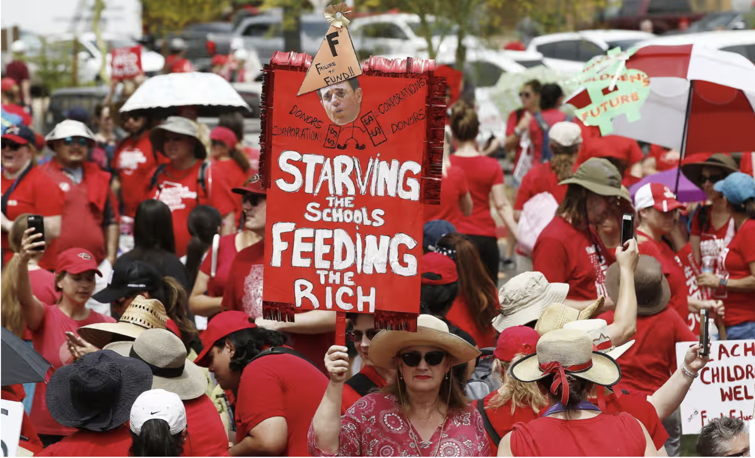 In April 2018, thousands of schoolteachers, wearing matching red T-shirts, descended on Arizona’s state capitol in Phoenix on the first day of a statewide strike. Chanting “Red for Ed,” the teachers walked out after Governor Doug Ducey proposed a raise that still left them among the worst paid education workers in the country—and after they learned that the offer would be underwritten by cutting other state programs. The governor’s idea of “taking money already designated for other worthy purposes,” commented one Arizona union official, “is a ‘rob Peter to pay Paul’ scheme that is wrong and unacceptable.” The Arizona teachers’ action was part of a wave of strikes across the country that extended into the next year, demanding higher wages and challenging austerity and privatization measures undermining public education.