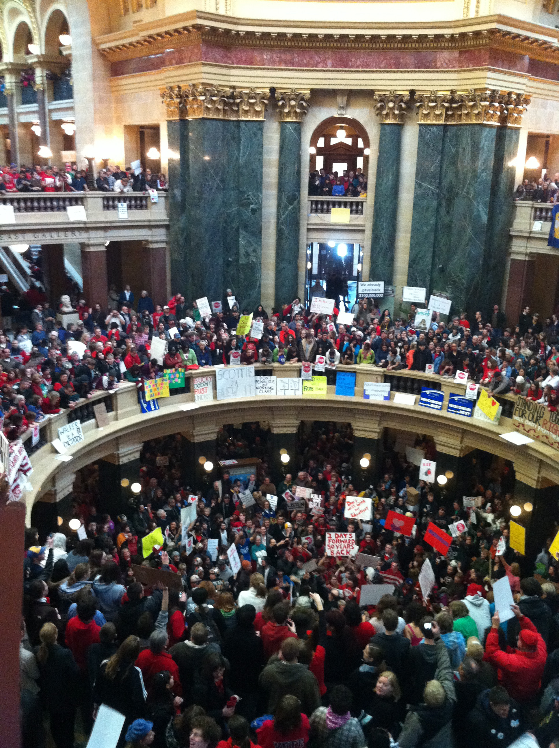 In 1959, Wisconsin became the first state to recognize public employee unions. In 2011, shortly after he took office, Republican governor Scott Walker proposed the deceptively titled Wisconsin Budget Repair Bill. Among its provisions, the bill targeted collective bargaining for almost all of Wisconsin’s public workers, framing the measure as a way to solve the state’s budget deficit. Beginning February 15, tens of thousands of public workers, along with other trade unionists and sympathetic professionals and students, amassed in and around the Wisconsin State Capitol in Madison. As demonstrations supporting public workers spread around the state, the number of protesters at the Capitol increased over the rest of the week, reaching seventy thousand. The fight in Wisconsin garnered coverage and sympathy all over the country, but in March, despite intensive opposition by minority Democratic legislators, the bill was passed.