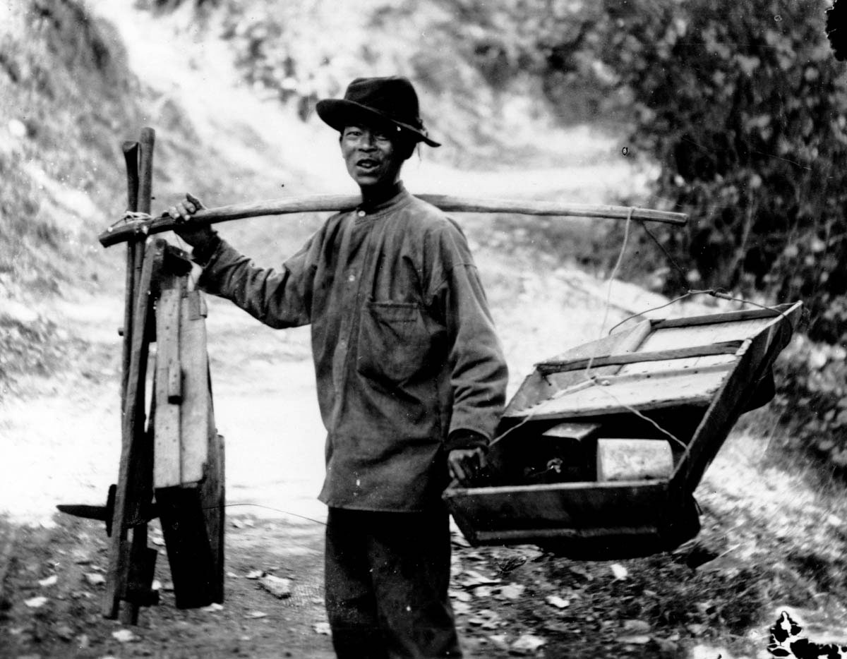 With the aid of a shoulder pole, which derived from his homeland, a Chinese immigrant carried one of the prospector’s essential tools: a rocker box, also known as a cradle. While a sluice box was used in streams to retrieve gold, the rocker box was designed for dry places. Miners poured a small amount of water into the box and then rocked it from side to side until dirt and other materials sifted through its perforated bottom, leaving the heavier gold behind.