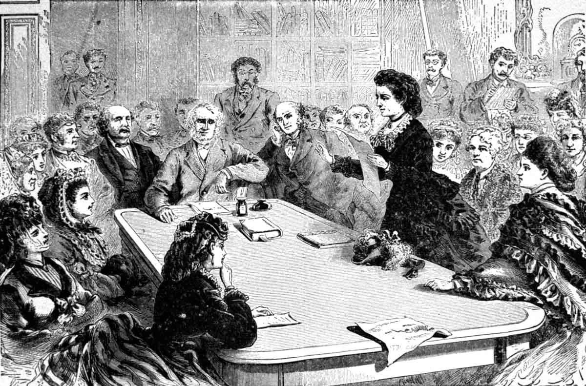 A delegation of women, including Victoria Woodhull (standing) and Elizabeth Cady Stanton (seated behind her), argued for voting rights before the Judiciary Committee of the House of Representatives in January 1871.