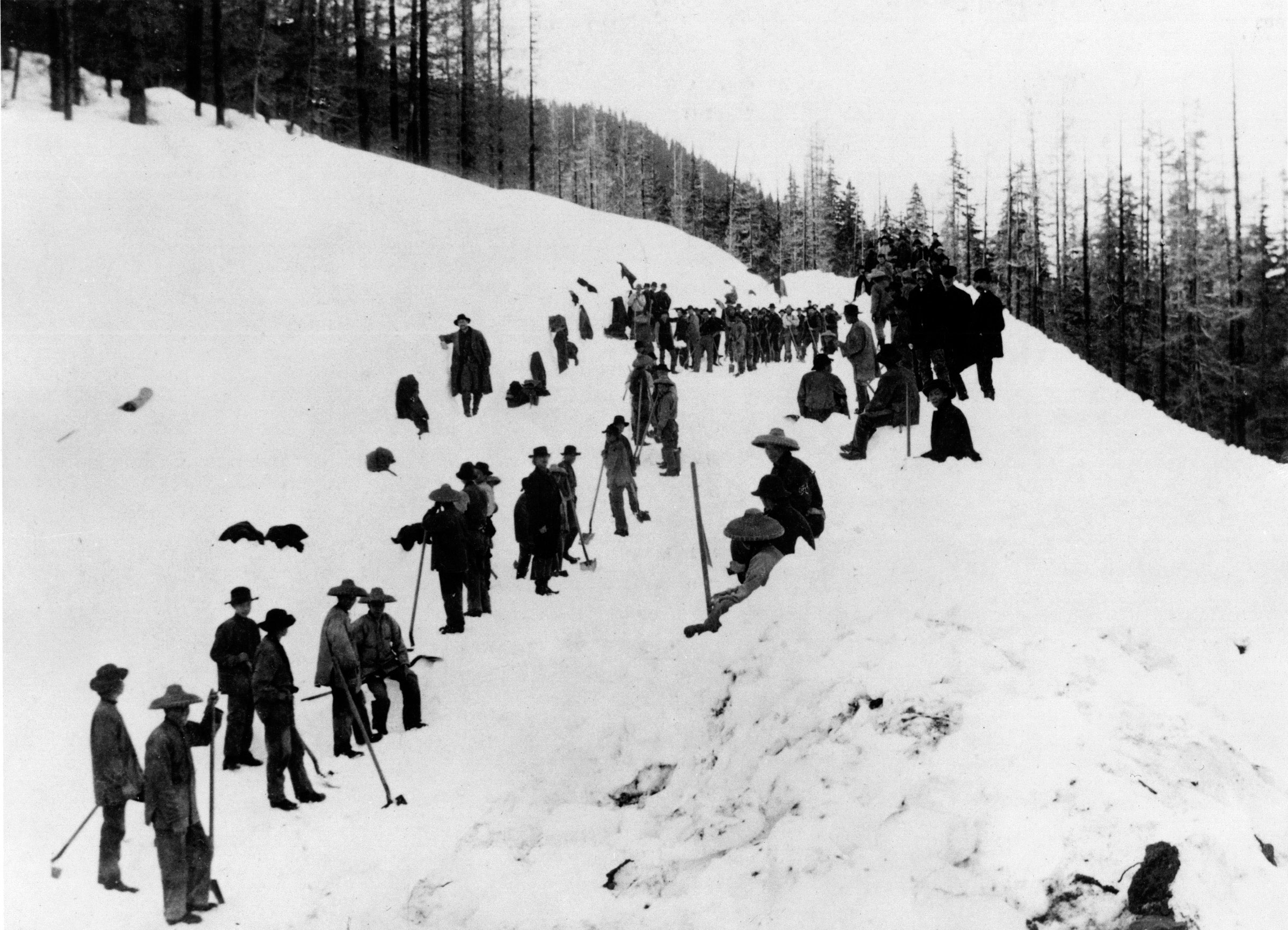 Chinese workers constructing a tunnel on the Northern Pacific Railway were photographed sometime in the 1880s as they cleared a switchback (a zigzag, uphill road) in the Cascade Mountains of Washington.