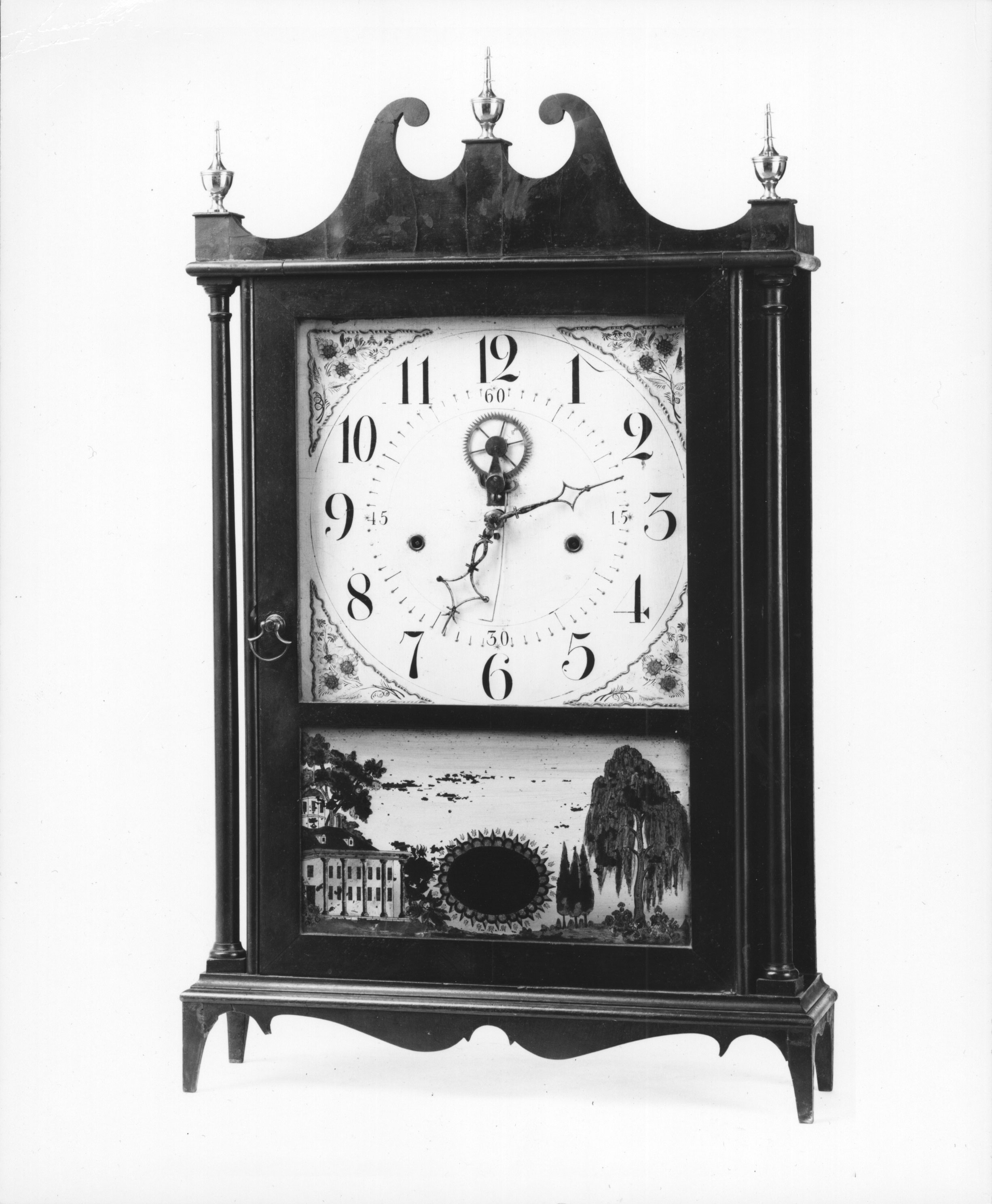 Eli Terry’s invention of a new box or shelf clock (only twenty inches tall) around 1816 transformed the clock industry and the very notion of a clock. The small and affordable shelf clock became the standard nineteenth-century timepiece, sold throughout the United States by a network of peddlers. Before Terry’s innovation, clocks were large and expensive objects made of imported brass. The box clock used less expensive wooden parts that were interchangeable—and it even came in its own case!