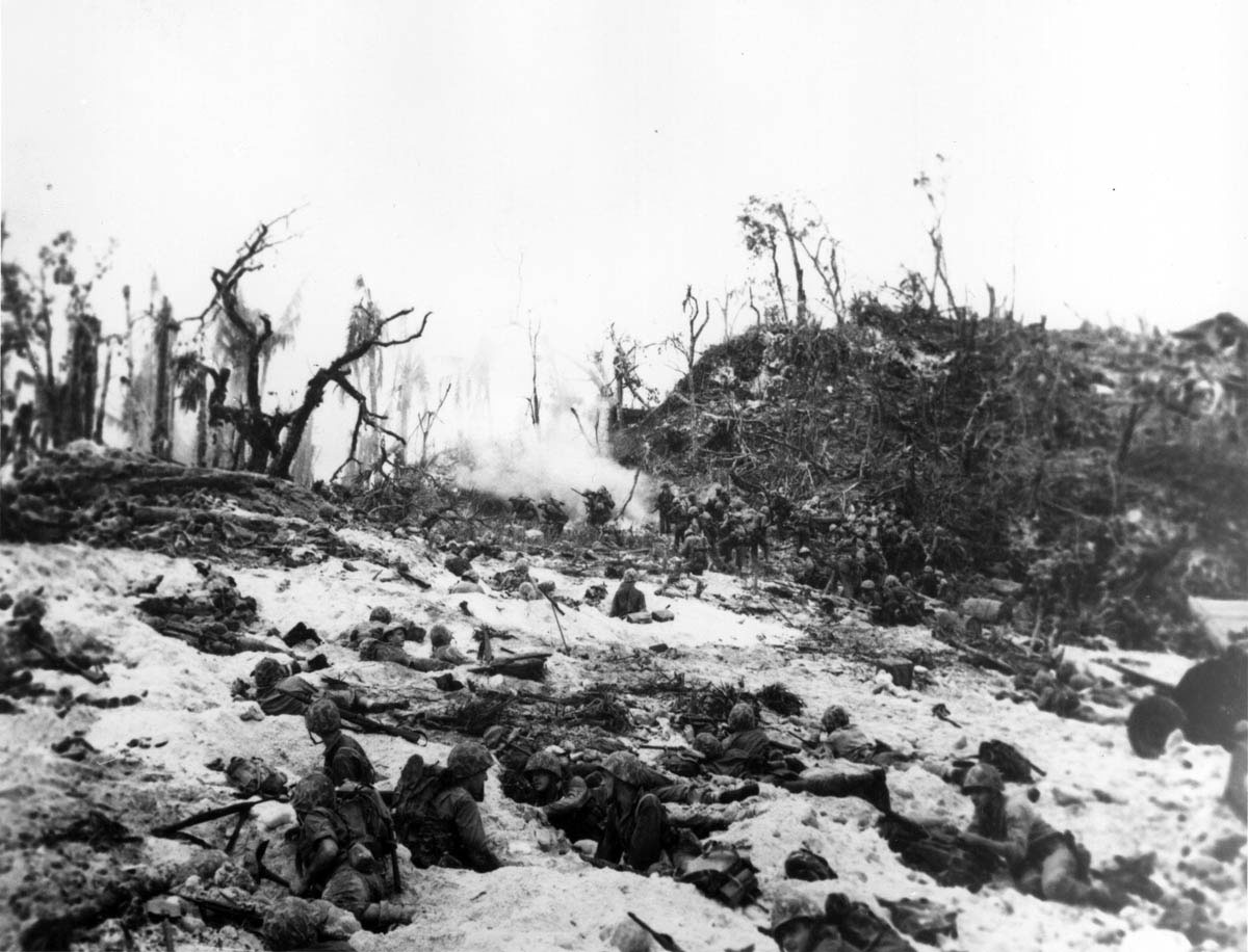 Oppressed by 115-degree heat and trapped by withering Japanese fire, U.S. Marines took cover in the sandy terrain of the small Central Pacific island. The battle was part of the U.S. strategy for the reconquest of the Philippines. After more than two months, 2,336 deaths, and 8,450 casualties, American forces prevailed (10,695 Japanese were killed).