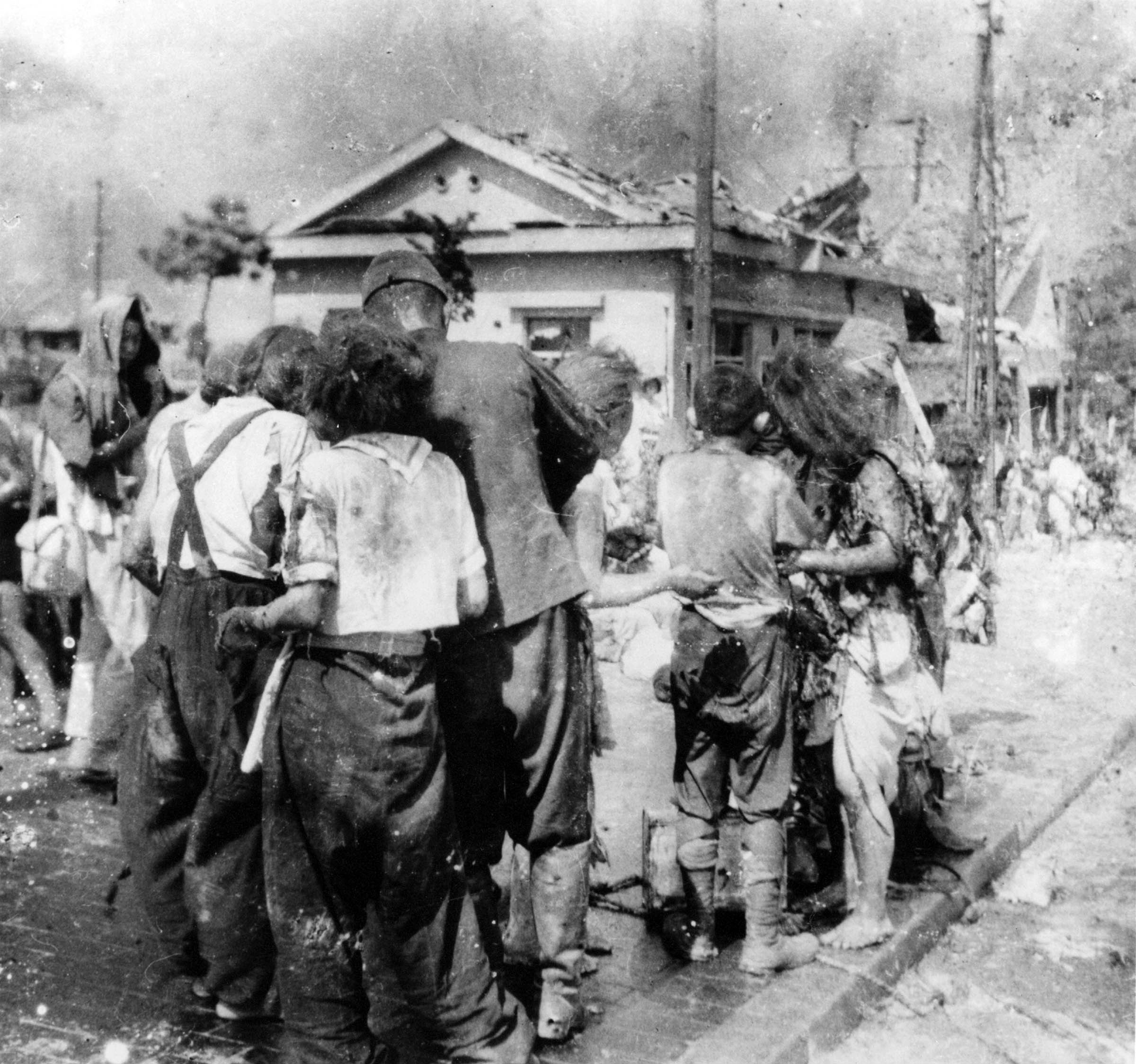 Three hours after the United States detonated an atomic bomb over Hiroshima, shocked and wounded survivors wandered near a bridge a little over a mile from ground zero.