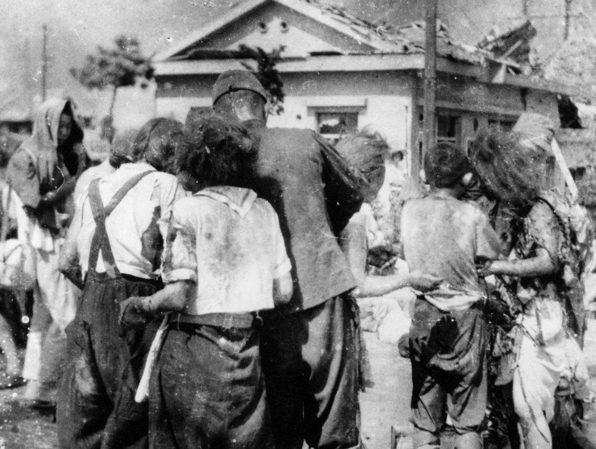 Three hours after the United States detonated an atomic bomb over Hiroshima, shocked and wounded survivors wandered near a bridge a little over a mile from ground zero.