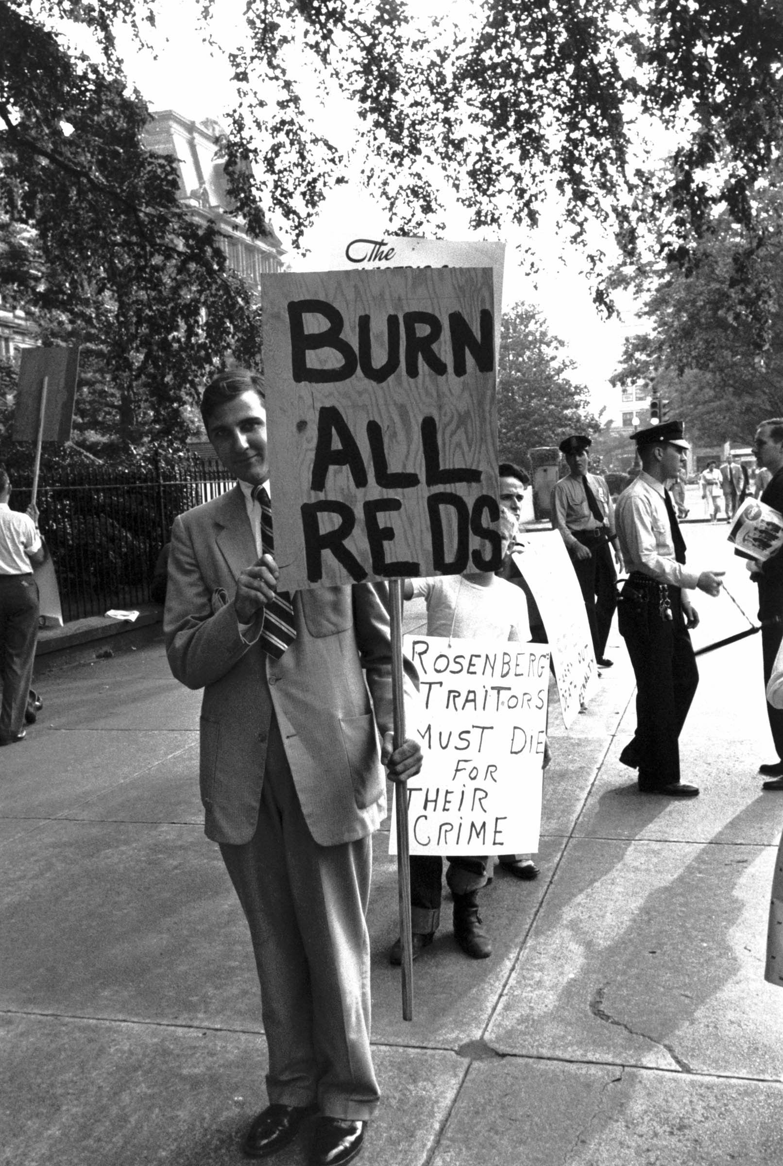 Despite the calm demeanor of this anti-Rosenberg picketer at a 1953 demonstration in Washington, D.C., the message on his sign suggests the intensity of anti-Communist hysteria in the postwar period.