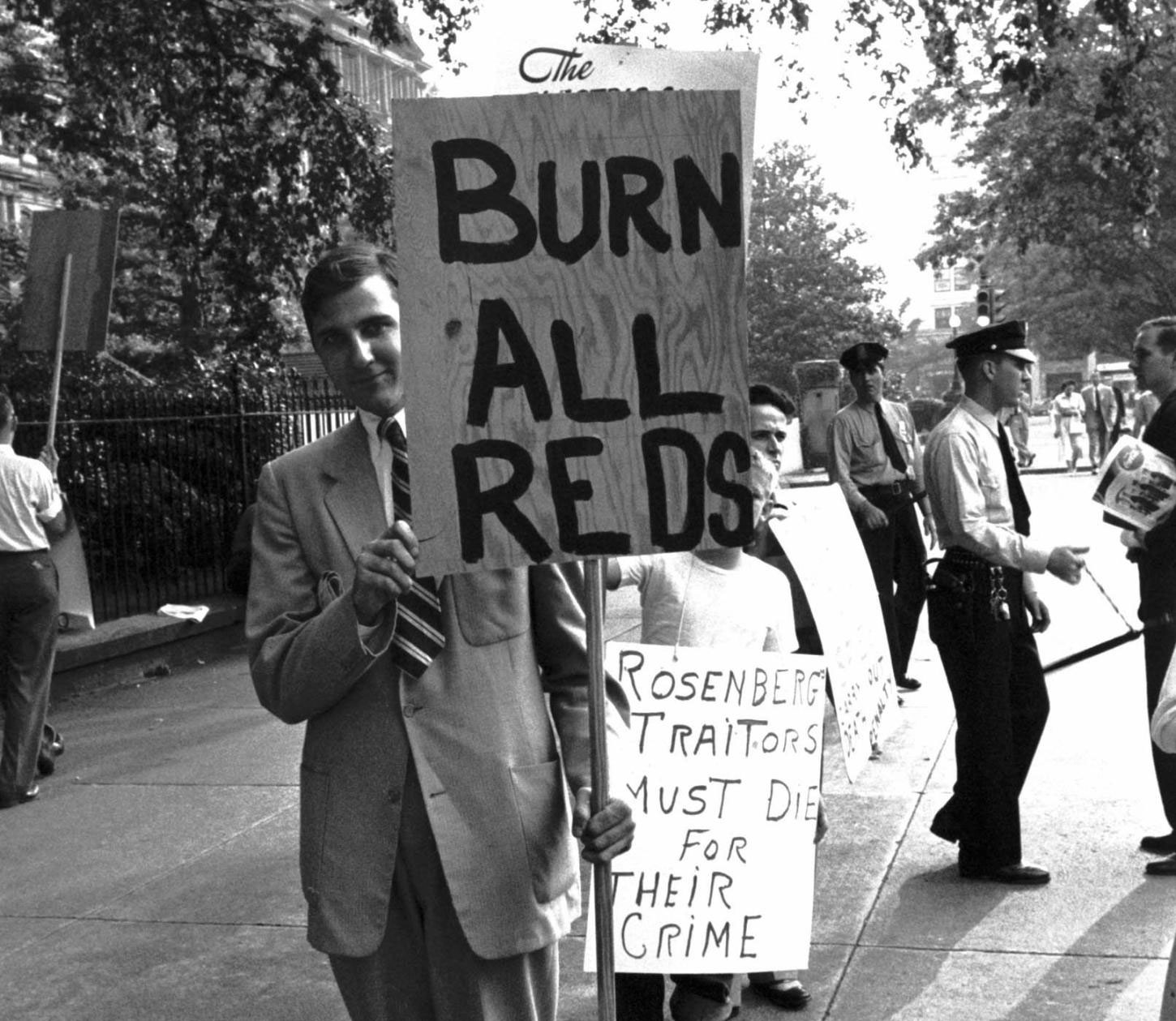 Despite the calm demeanor of this anti-Rosenberg picketer at a 1953 demonstration in Washington, D.C., the message on his sign suggests the intensity of anti-Communist hysteria in the postwar period.