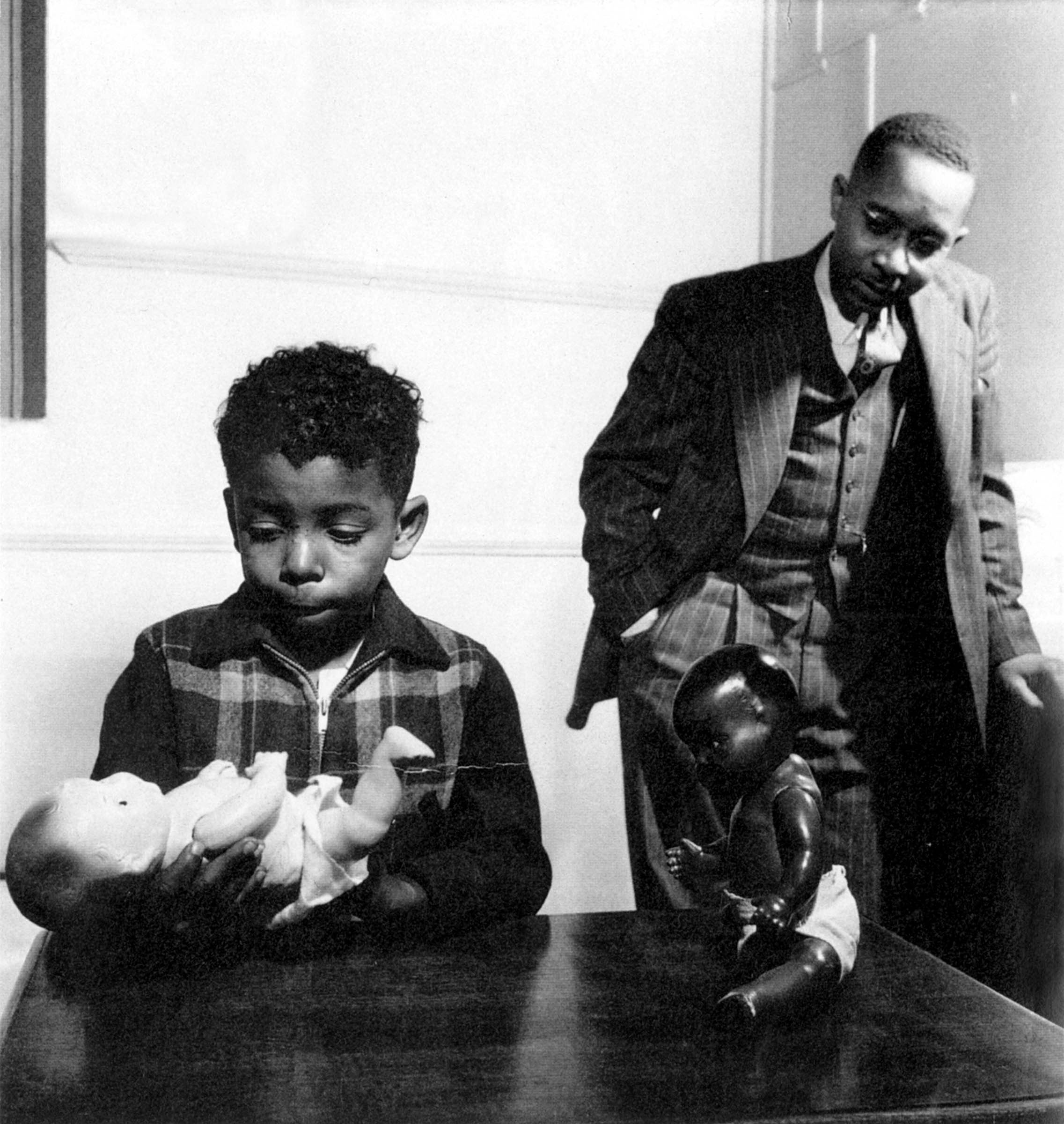 Studies conducted by sociologists Kenneth Clark (right) and Mamie Phipps Clark at their Northside Center for Child Development in Harlem demonstrated the detrimental impact of segregation on African American children. For example, when asked to choose between a white and a Black doll, African American children from segregated environments preferred and identified with the white one. These studies were instrumental in convincing the Supreme Court in its 1954 <em>Brown v. Board of Education</em> decision that racial segregation in public schools was unconstitutional.