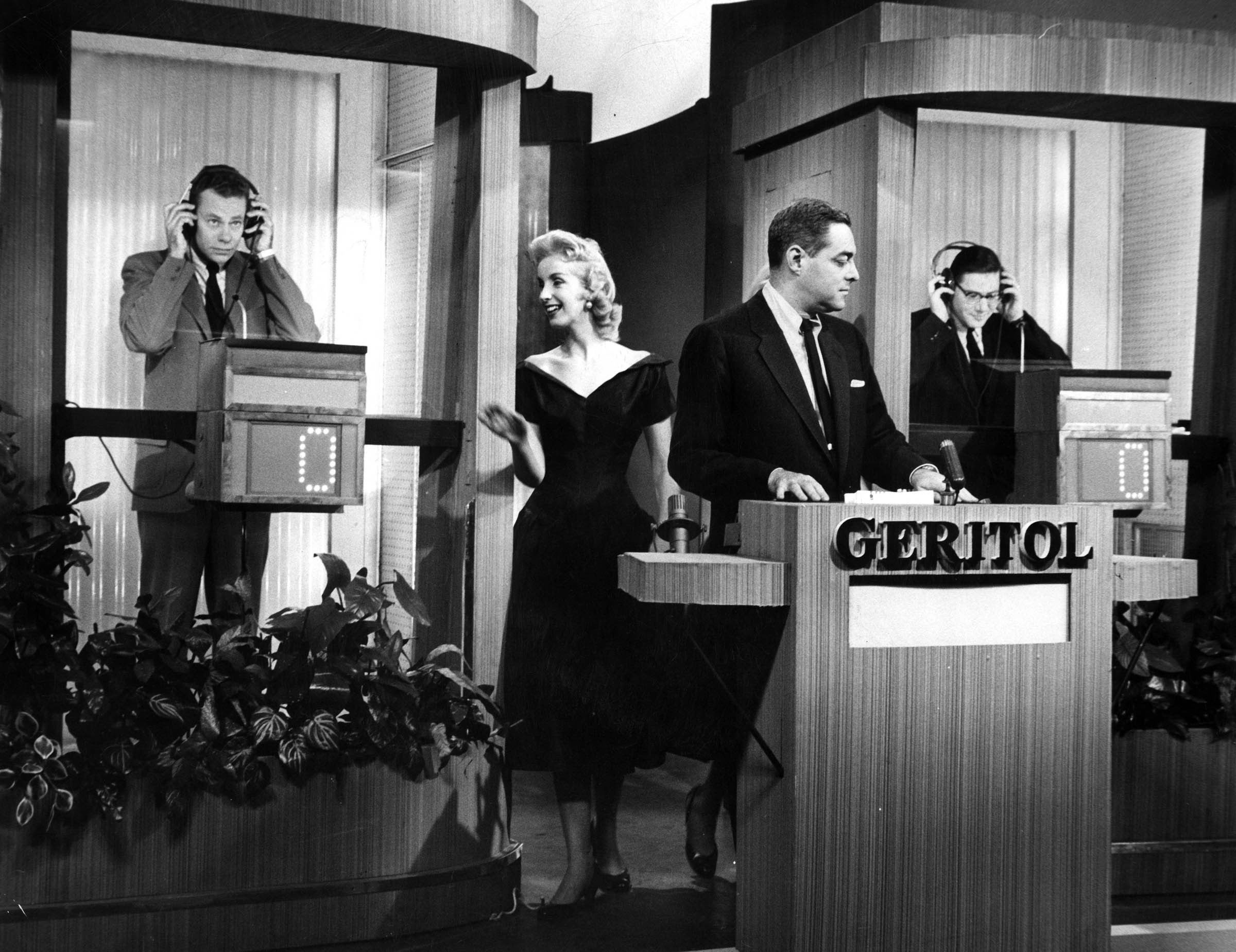 Columbia University English instructor Charles Van Doren (left) was the most renowned quiz show celebrity, going on from his triumph on NBC’s <em>Twenty-One</em> to become one of the stars of the network’s <em>Today</em> show. However, a 1959 congressional investigation revealed that many of the big-money game shows were rigged. Van Doren was implicated in the scandal, which led to fraud indictments and his disappearance from television.