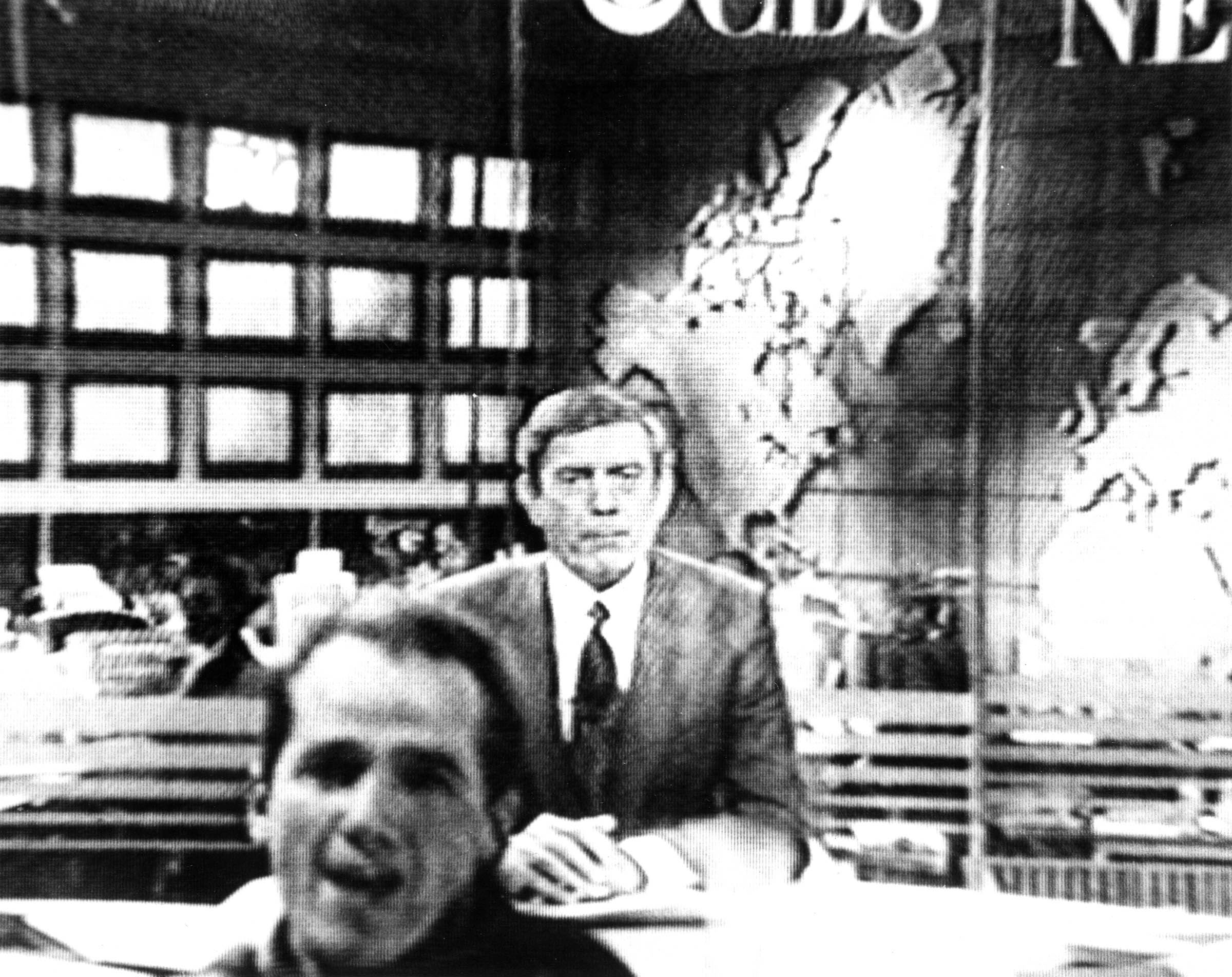 An ACT-UP protestor, shouting, “Fight AIDS, not Arabs,” interrupts anchor Dan Rather during the January 22, 1991, broadcast of the <em>CBS Evening News</em>.