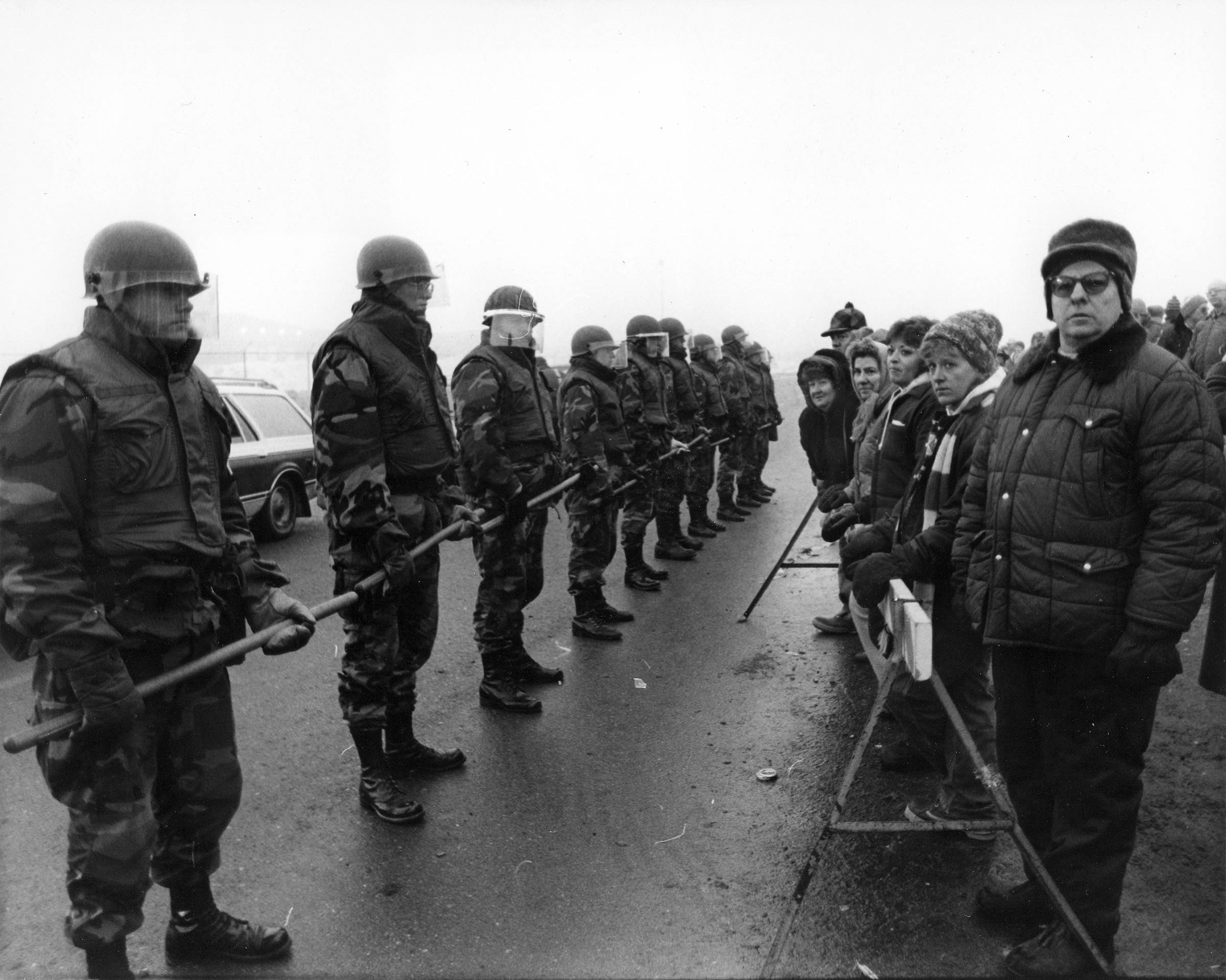 P-9 strikers and supporters in Austin, Minnesota, confront the Minnesota National Guard outside the Hormel plant on a cold January morning in 1986.