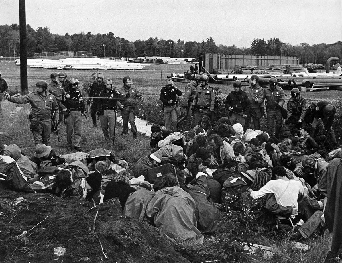 Many activists who opposed the proliferation of nuclear weapons and nuclear power facilities used direct-action tactics to forestall the building of reactors. On May Day 1977, thousands of demonstrators affiliated with the Clamshell Alliance blocked construction of a nuclear plant in Seabrook, New Hampshire. Almost 1,500 were arrested and jailed in armories around the state. After two weeks, the armories were still filled because many demonstrators refused to leave until all “clams” were unconditionally released. Governor Meldrin Thompson, who had hoped to stem protest with mass arrests, relented, releasing them all.