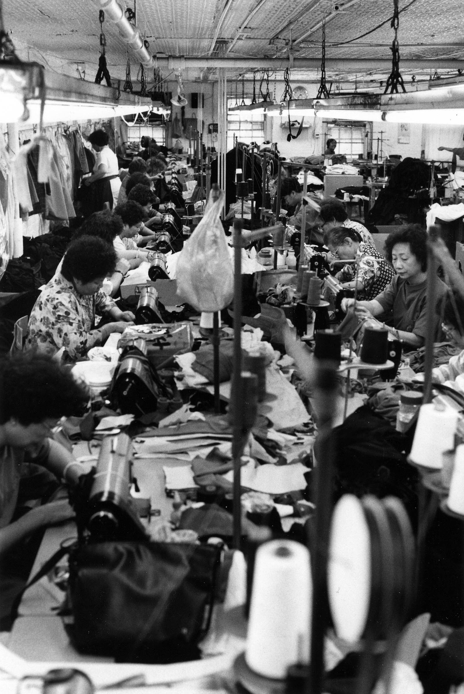 Asian workers laboring in a garment shop in lower Manhattan in 1991. The setting was reminiscent of sweatshop working conditions in the clothing industry earlier in the twentieth century.