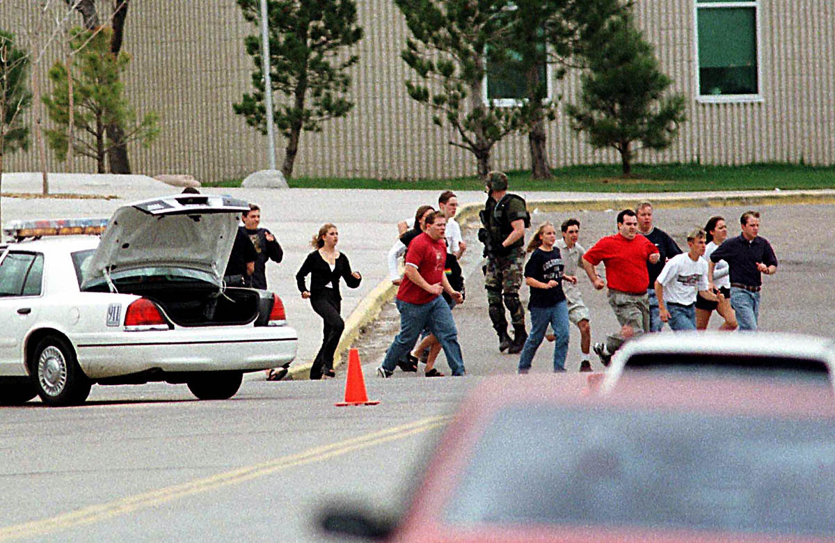 Students flee Columbine High School in Littleton, Colorado, after two teenagers armed with automatic weapons and explosives murdered twelve of their classmates and a teacher before committing suicide. The April 1999 incident highlighted the fearful toll of the estimated two hundred million guns in circulation in the United States, particularly their impact as a major “health problem” for young Americans. According to the Centers for Disease Control and Prevention, 4,643 children and teenagers were killed with guns in 1996 (including 1,309 suicides and 468 unintentional shootings). The <em>Journal of the American Medical Association </em>estimated that the cost of medical care for gun-related injuries amounted to  billion in 1995 alone. Since 1960, a million people have died from gunshots in the United States.