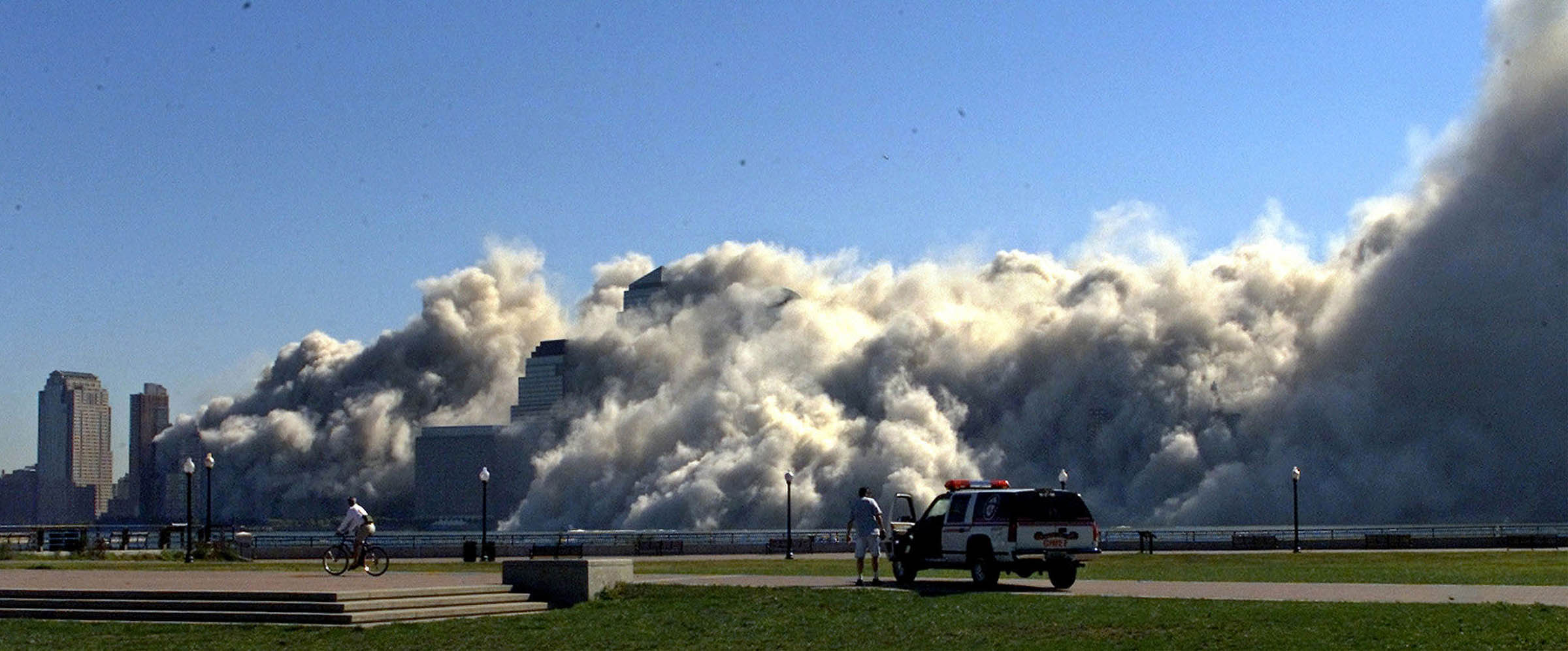 An anonymous photojournalist captured this scene of first responders wading through the remains of a collapsing building on the morning of September 11th, 2001, near the World Trade Center in Manhattan. The thick cloud of toxic dust and debris that emanated from the destruction of the two buildings spread over downtown Manhattan. The dust and debris has been linked to increased rates of illness in those who were exposed to it, including first responders, area residents, and workers tasked with cleaning nearby office buildings in the months after the attacks.