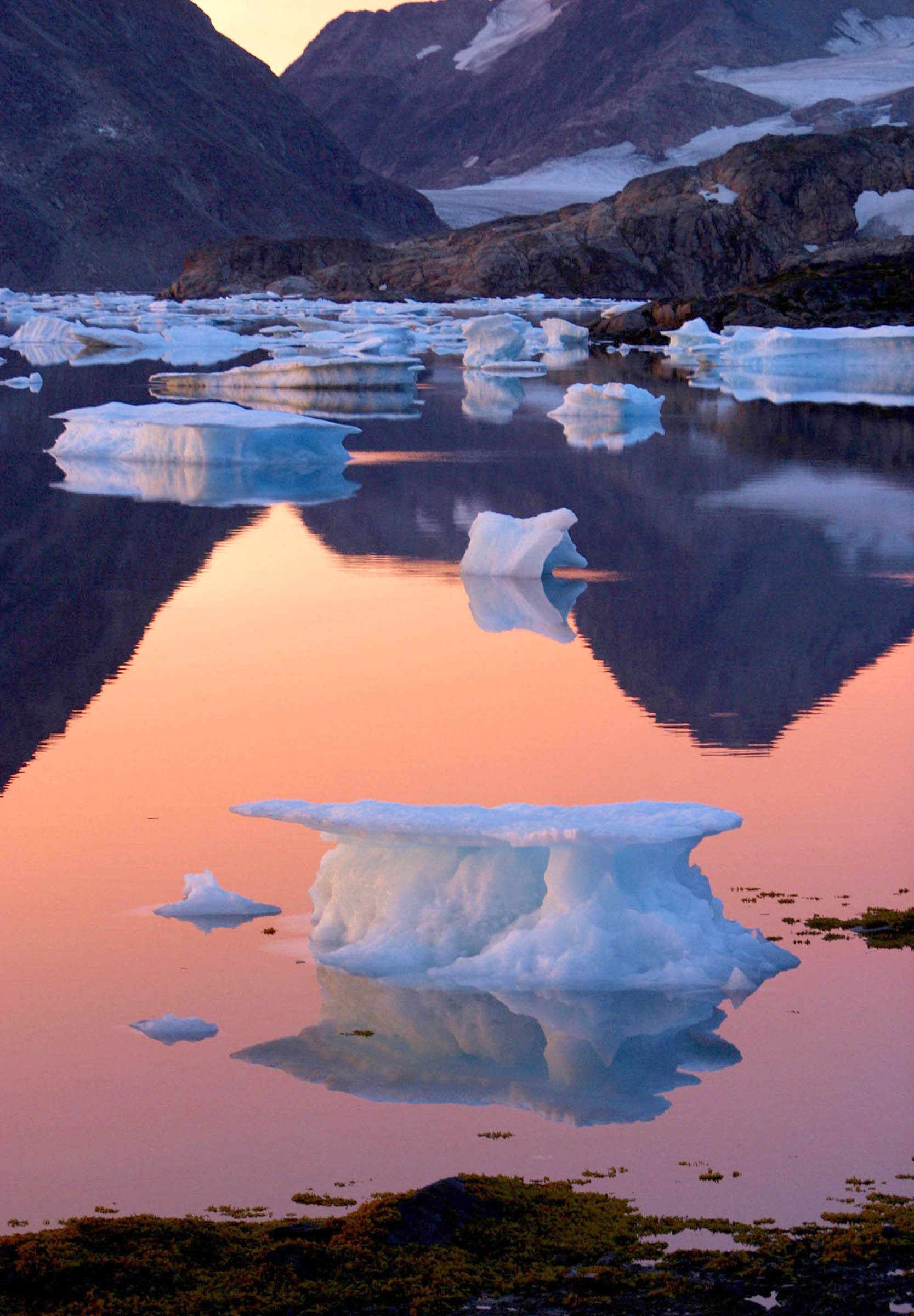 Scientists are concerned about the accelerated melting of Greenland’s 700,000-square-mile ice sheet because of the rise in worldwide temperatures caused largely by carbon dioxide emissions (the “greenhouse effect”). Climatologists predict that even the slow melting of the ice sheet, which contains one-tenth of the world’s freshwater reserves, will severely affect coastal sea levels and contribute to the extinction of species and increasingly catastrophic storms. Meanwhile, the United States, the largest producer of greenhouse emissions, refuses to sign international treaties restricting airborne pollution.