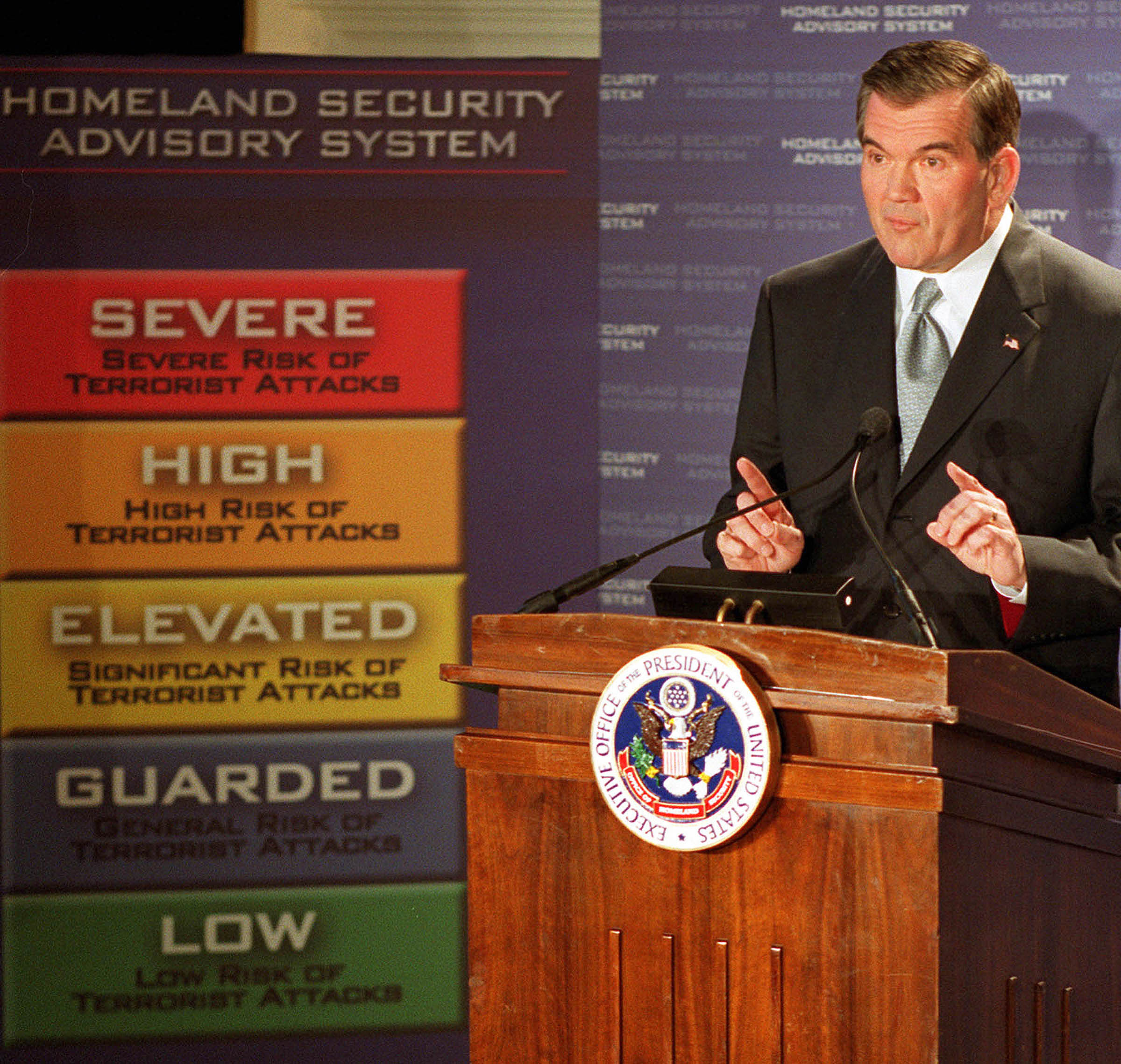 Homeland Security chief Tom Ridge introduces a color-coded threat advisory system in March 2002. The five alert levels, escalating from green for a low-level warning to “severe risk” red, was supposed to inform the public about imminent terrorist threats and prompt appropriate preventive measures on the part of federal and local government agencies. But critics noted that the criteria for subsequent alerts were confusing and possibly motivated by partisan political aims.