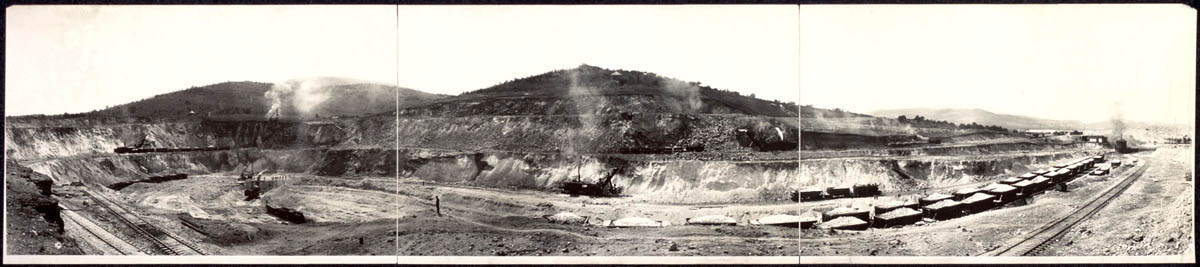 Copper deposits were first found in the hills outside Ely, Nevada, in the 1870s. Mining the copper became profitable only around 1900, with the building of railroad lines and investment by eastern capital. After that, large profits were made by the Nevada Consolidated Copper Company and others by digging open-pit mines in which terraces were cut into the landscape. The mining left the landscape scarred, hillsides denuded, and groundwater contaminated. The Copper Flat pit would eventually measure more than a mile across and almost 1,000 feet deep.