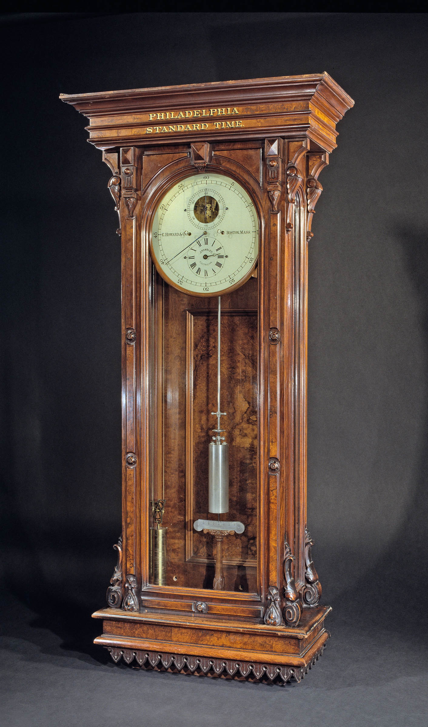 This E. Howard Wall Regulator clock hung in the offices of the Baltimore Ohio Railroad. Railroads spurred standardization in several facets of industrial life: rail equipment, business organization, and train schedules. Until 1883, Americans followed solar time, each locality setting clocks at noon on the basis of when the sun reached its highest point. However, each railroad maintained a single time across its entire line, leading to discrepancies in the schedules of competing lines as well as in localities across the continent. In 1883, a group of railroad superintendents instituted the new system of standard time with four time zones across the continental United States.