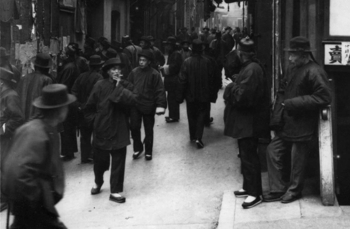 Arnold Genthe’s photographs of San Francisco’s Chinatown provide information about the Chinese community at the turn of the century. His characterization of his subjects, however, often conveys a distorted and ominous message. Despite its title, this photograph of Ross Alley, taken some time around New Year’s, simply depicts the unusual daytime congestion resulting from the seasonal unemployment of many Chinatown workers after the holiday.