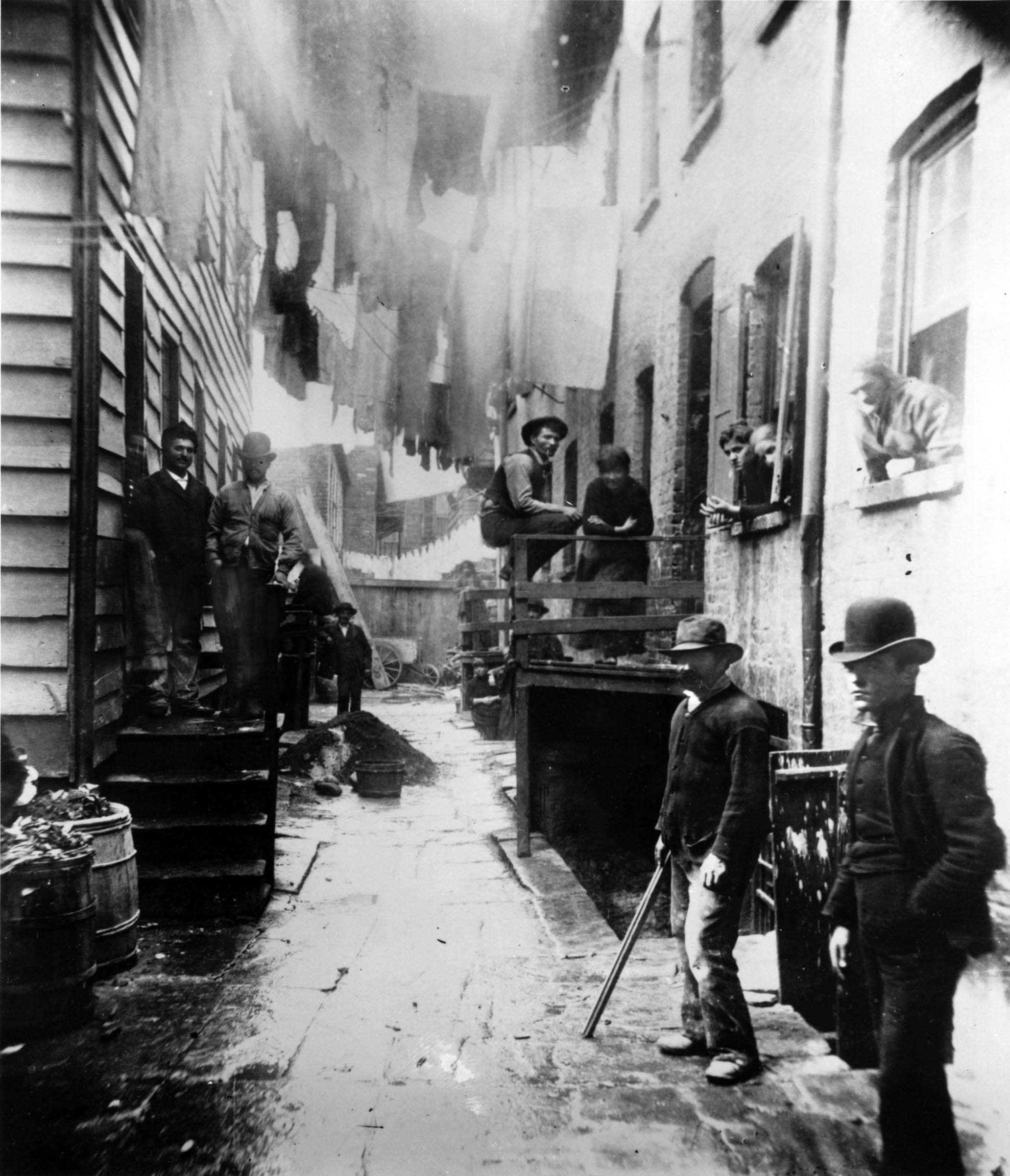 Great disparities between wealth and poverty accompanied the rapid expansion of U.S. cities. Reformer Jacob Riis’s photographs starkly portrayed “how the other half lives” to the audiences who attended his lantern-slide shows or saw engraved versions in newspapers. But, as is evident in this photograph of an alley on New York’s Lower East Side, Riis often posed and framed his subjects in ways that were meant to arouse not only sympathy but also fear and distaste among viewers.