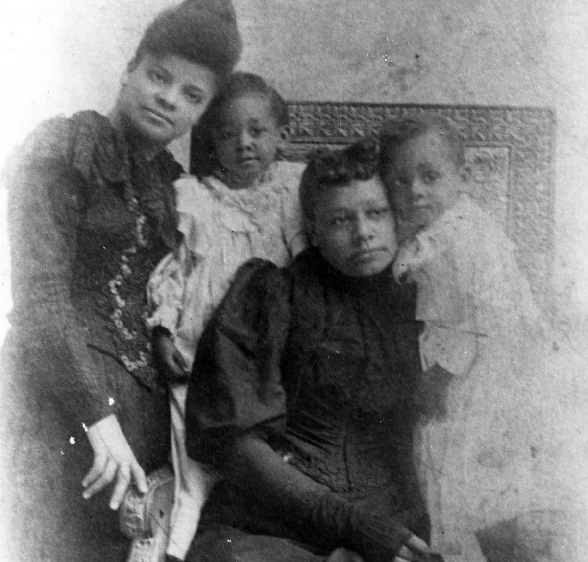 In 1892, Memphis, Tennessee, newspaper editor Ida B. Wells-Barnett revealed the role of local white businessmen in the lynching of three African American competitors. She is shown here standing with Betsy Moss and her two children, the widow and orphans of Memphis grocer Tom Moss, one of the murdered Black businessmen. A white mob destroyed Wells’s office, and she was forced to flee North, where her public lectures and writing brought lynchings to national attention.