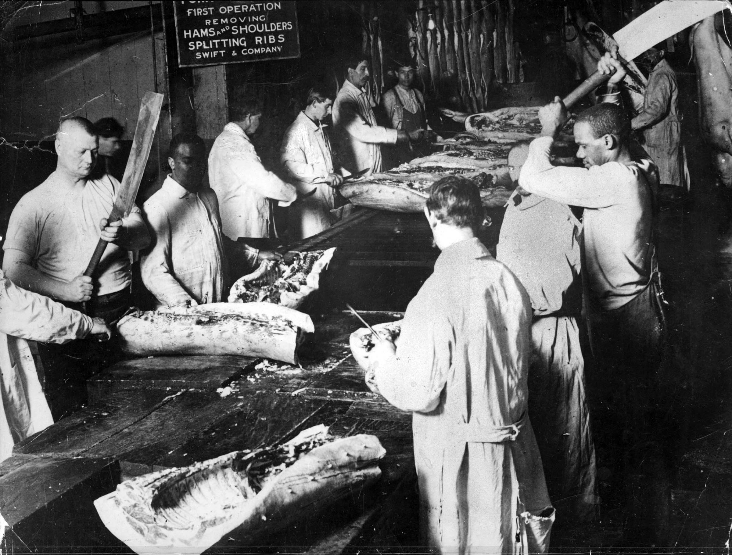 As shown here, workers at the Swift and Company meatpacking plant in Chicago performed specialized, repetitive tasks based on many of the same principles that Henry Ford used in the automobile assembly line.