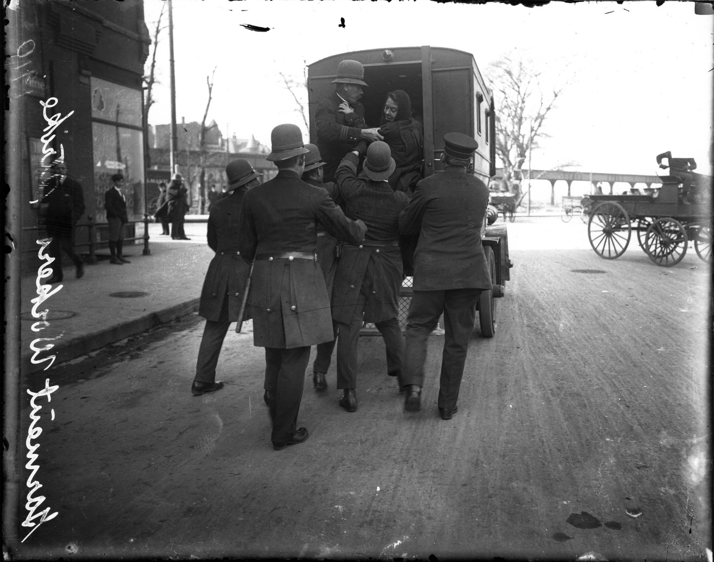 A garment worker is arrested by the Chicago police during a 1910 strike in which workers protested a cut in their piece rate. Some 40,000 workers throughout the clothing industry eventually walked off the job.