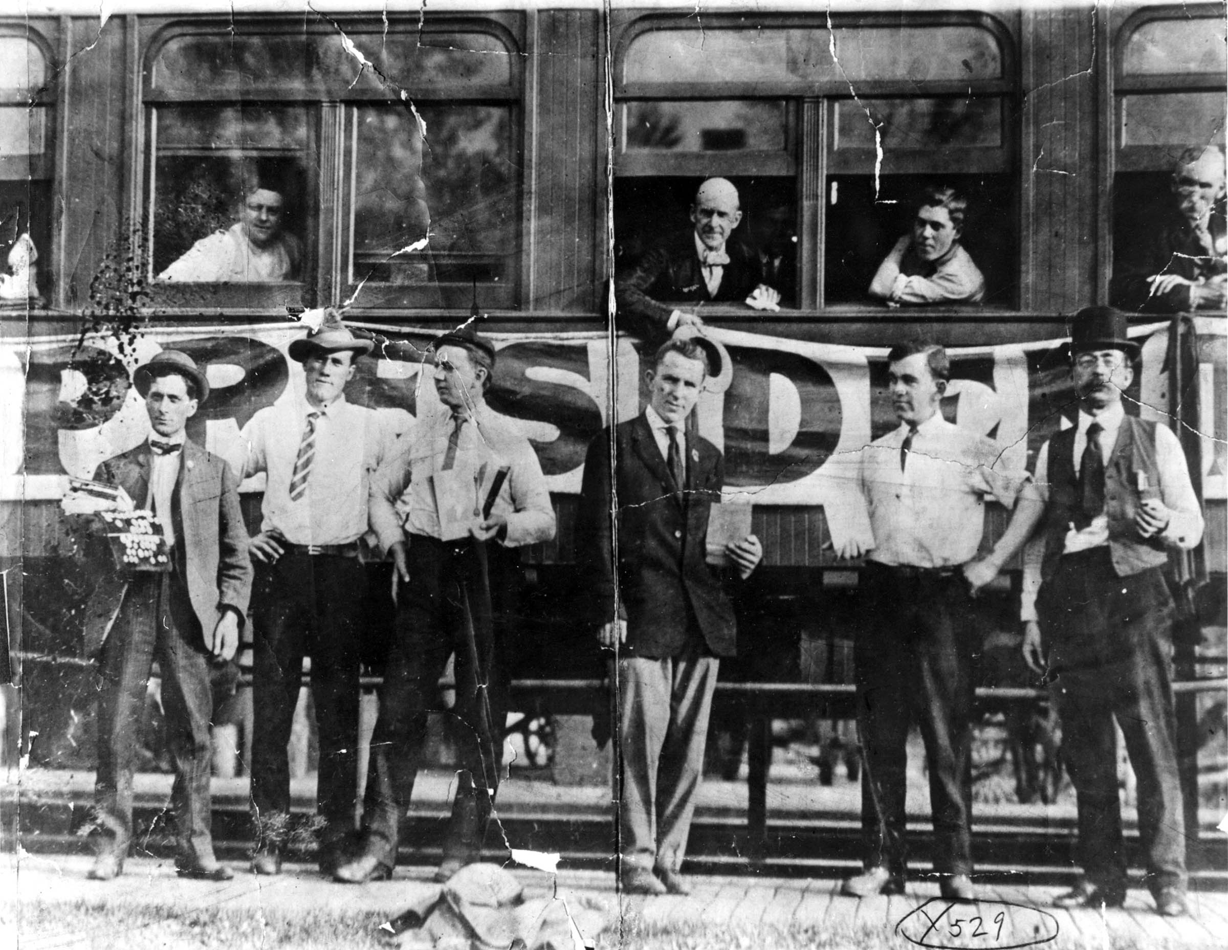 Eugene Debs, Socialist Party staffers, and the “Red Special” train on which the presidential candidate traveled during his 1908 whistle-stop campaign.