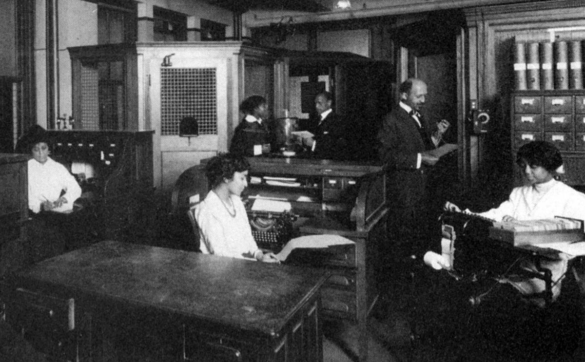 An undated photograph shows editor W. E. B. DuBois and his young staff in the New York City office of <em>The Crisis</em>, preparing an edition of the NAACP’s publication.