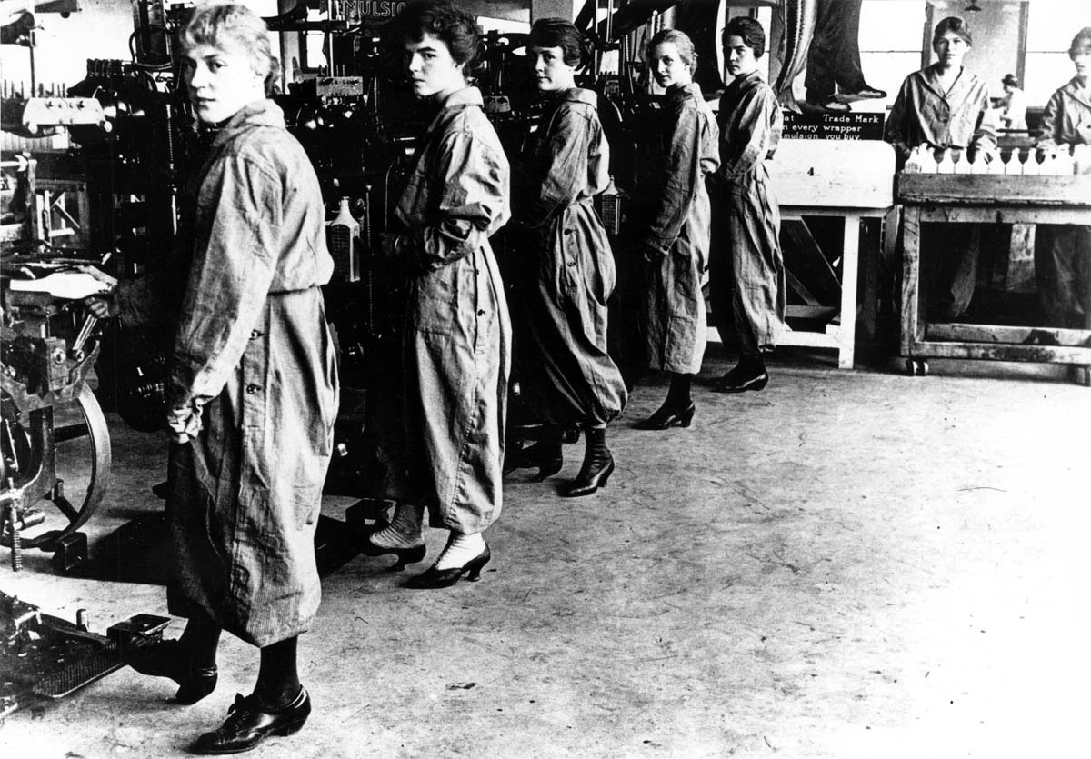 Recently hired women operate equipment in a Bloomfield, New Jersey, munitions plant around 1917.