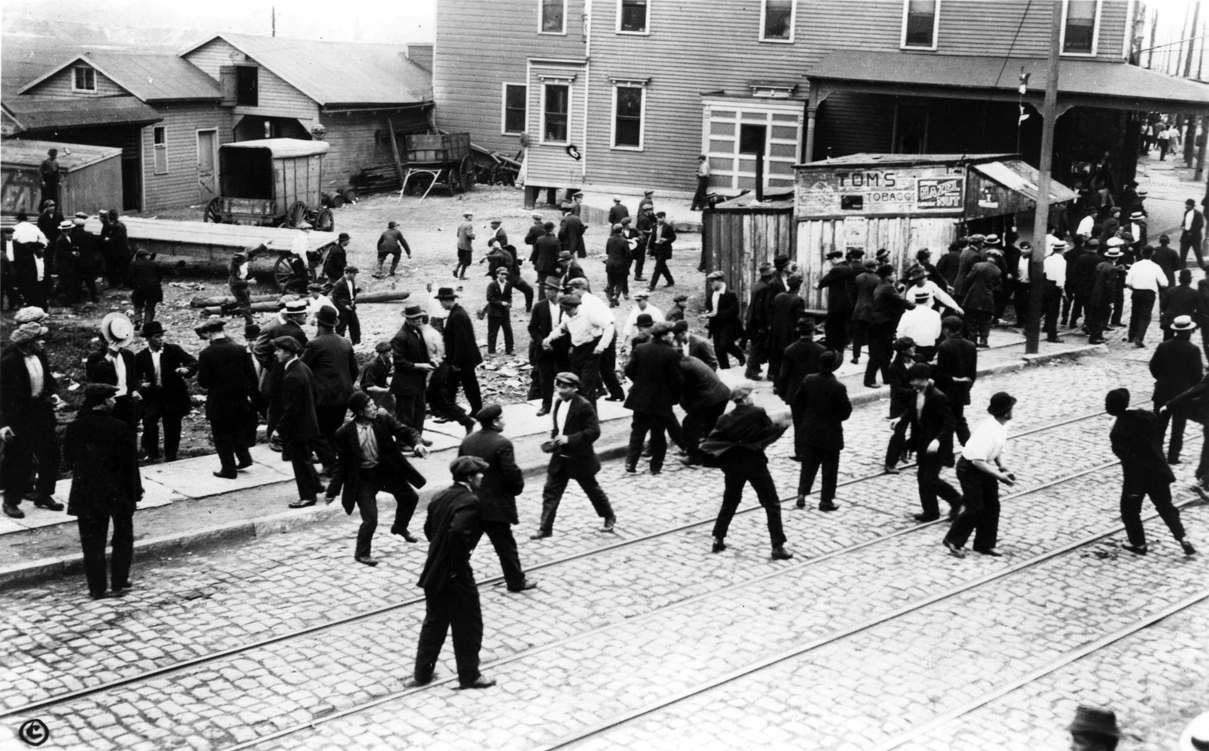 Moments after these striking workers were photographed confronting guards outside the Bayonne, New Jersey, Standard Oil Works, the private police opened fire, killing five strikers.