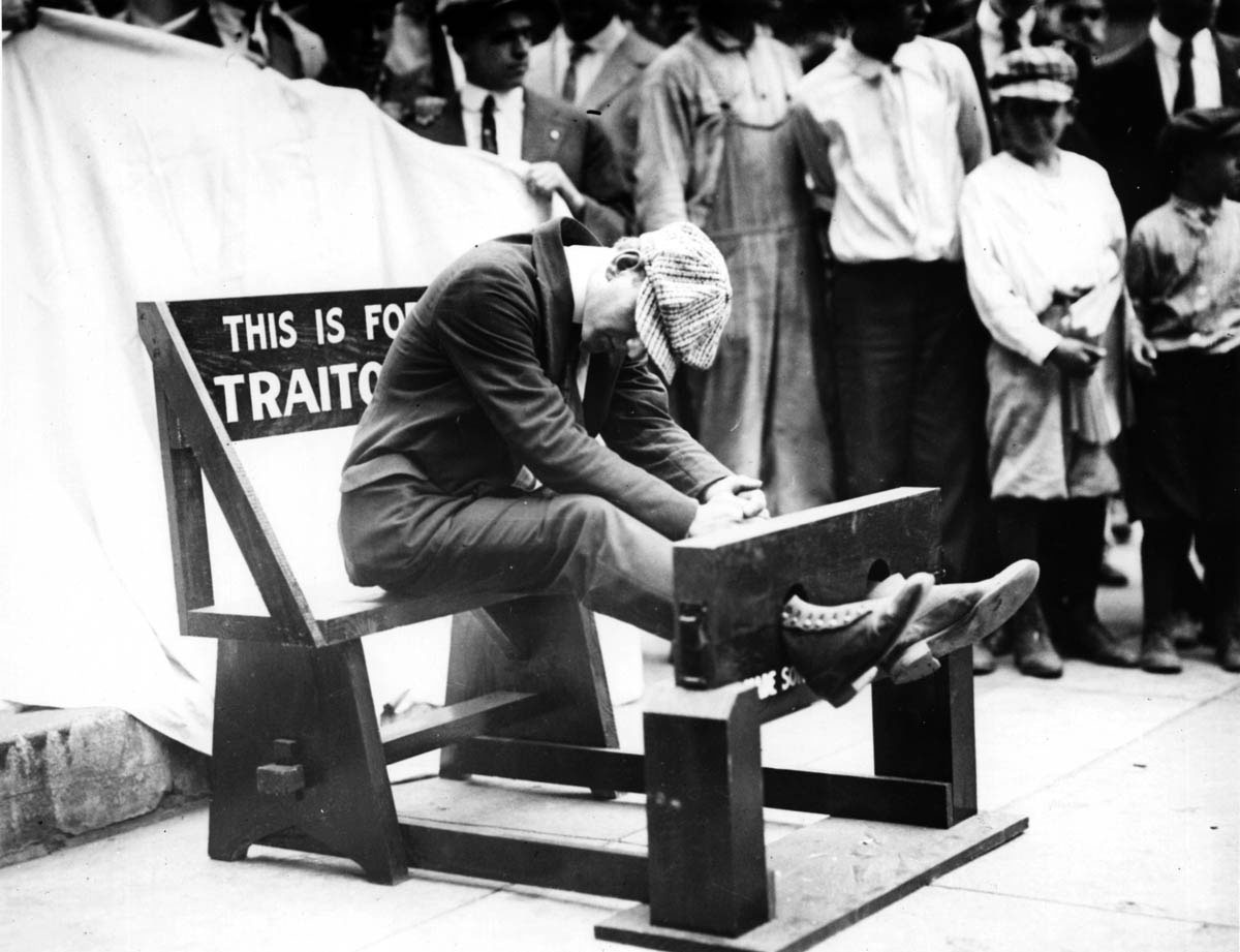 The pillory, a device that was used in colonial New England to punish through public ridicule, was resurrected in Cincinnati in 1918. Placed in a public square, this pillory was “a warning to citizens of Cincinnati as to what they may expect in case of disloyalty.” Unable to find a convenient dissenter immediately, the photographer of this picture had to make do with an acquiescent volunteer.