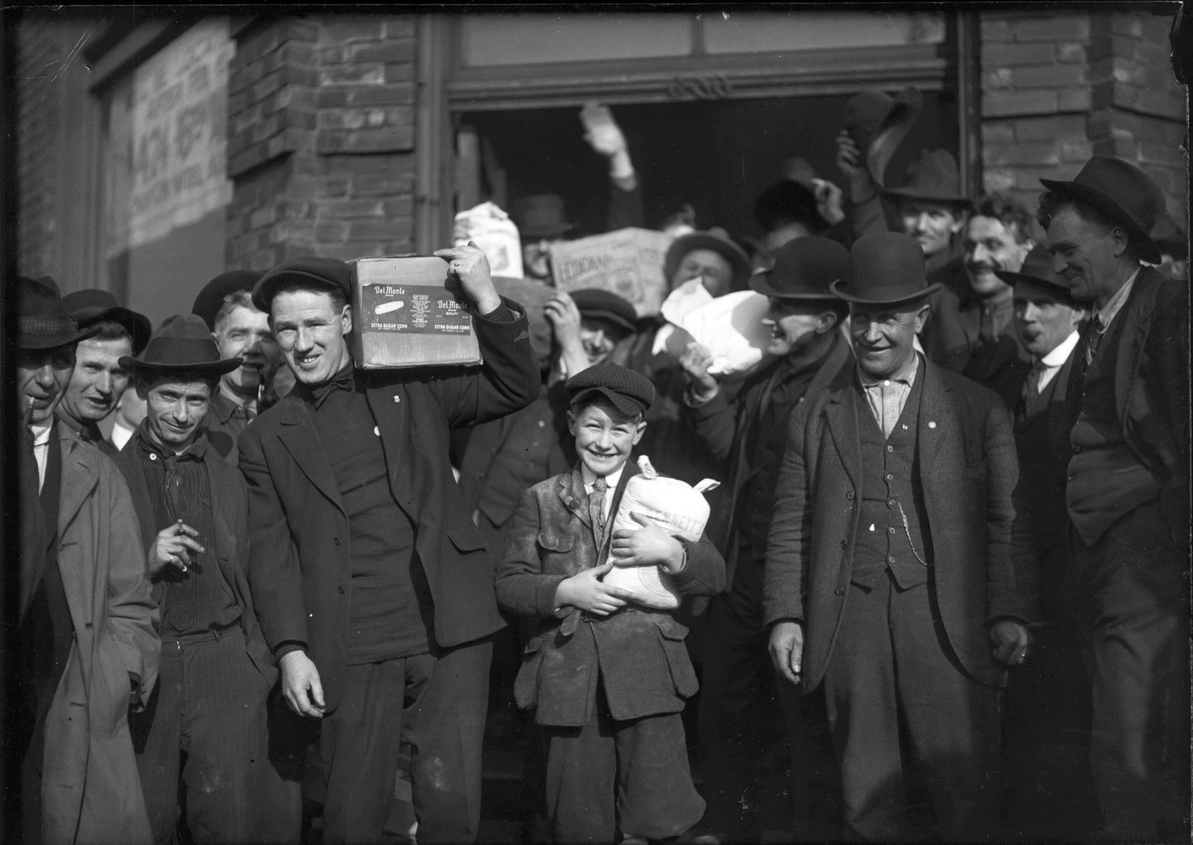 These strikers were photographed with groceries that the General Strike Committee had issued to union families.