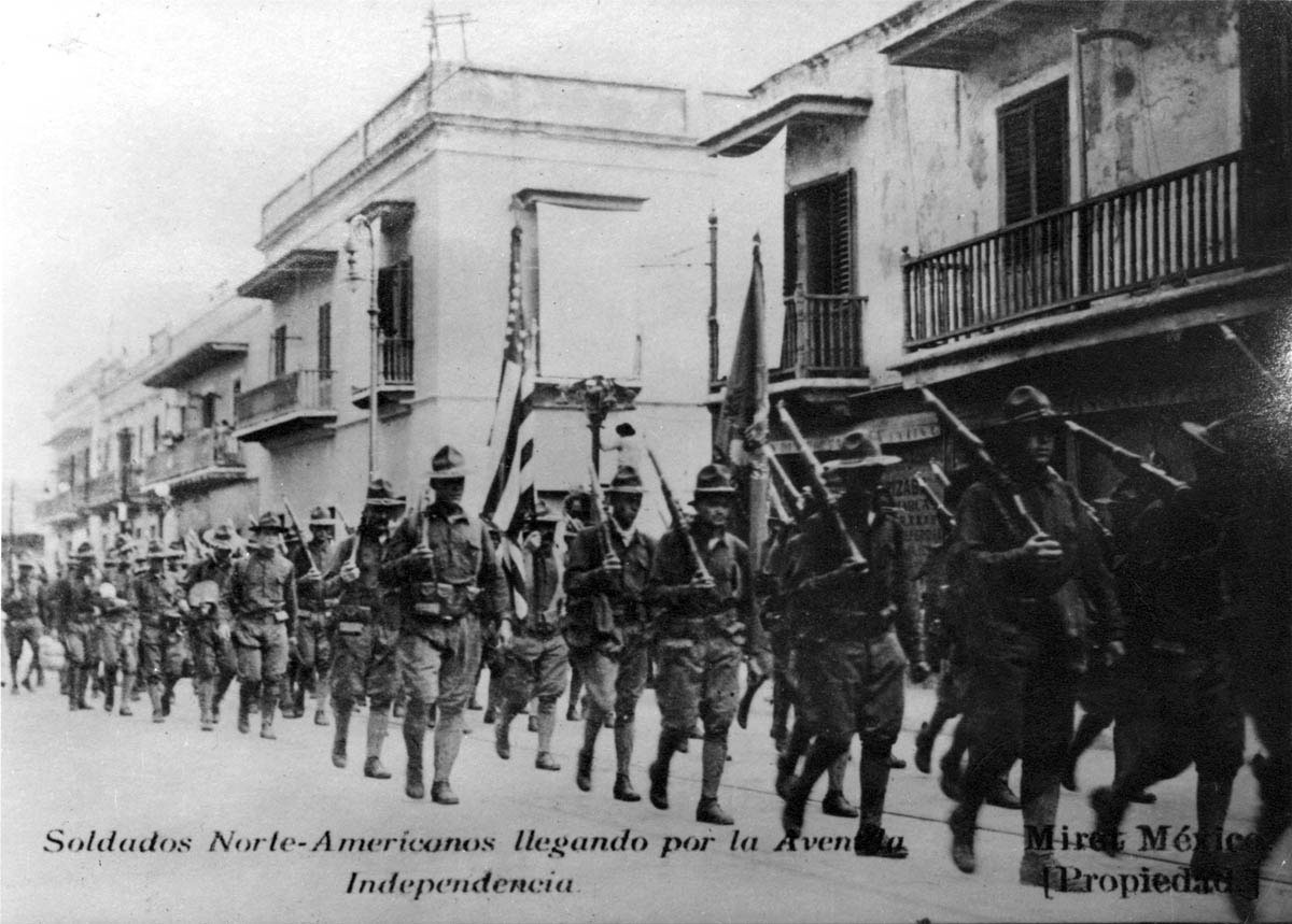 A 1914 Mexican postcard shows a company of U.S. soldiers marching along the Avenida Independencia in Vera Cruz. Postcards were a popular medium for disseminating photographic images of the war on both sides of the Mexican-U.S. border.