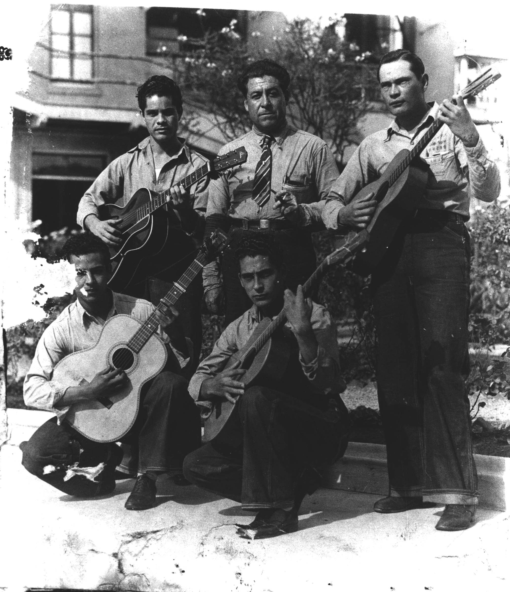 A vibrant musical community for Mexican music emerged in southern California in the 1920s and 1930s with the growth of the Mexican population, the arrival of immigrant musicians, and the rise of radio. Los Angeles commercial radio stations featured many hours of Spanish-language programming, often aired in the “dead” early-morning hours of the radio schedule. Longshoreman Pedro J. Gonzalez (in the center of the photograph) formed Los Madrugadores (“The Early Risers”) with other Mexican immigrants. As the group’s name suggested, its music reached an audience of working people as they prepared for early-morning work shifts.