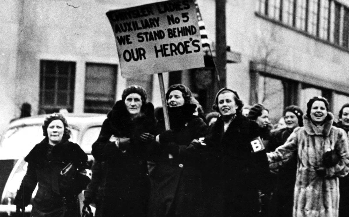 The UAW’s Women’s Emergency Brigade, along with members of the union local’s Women’s Auxiliary, marched in front of an occupied Chrysler plant in March 1937.