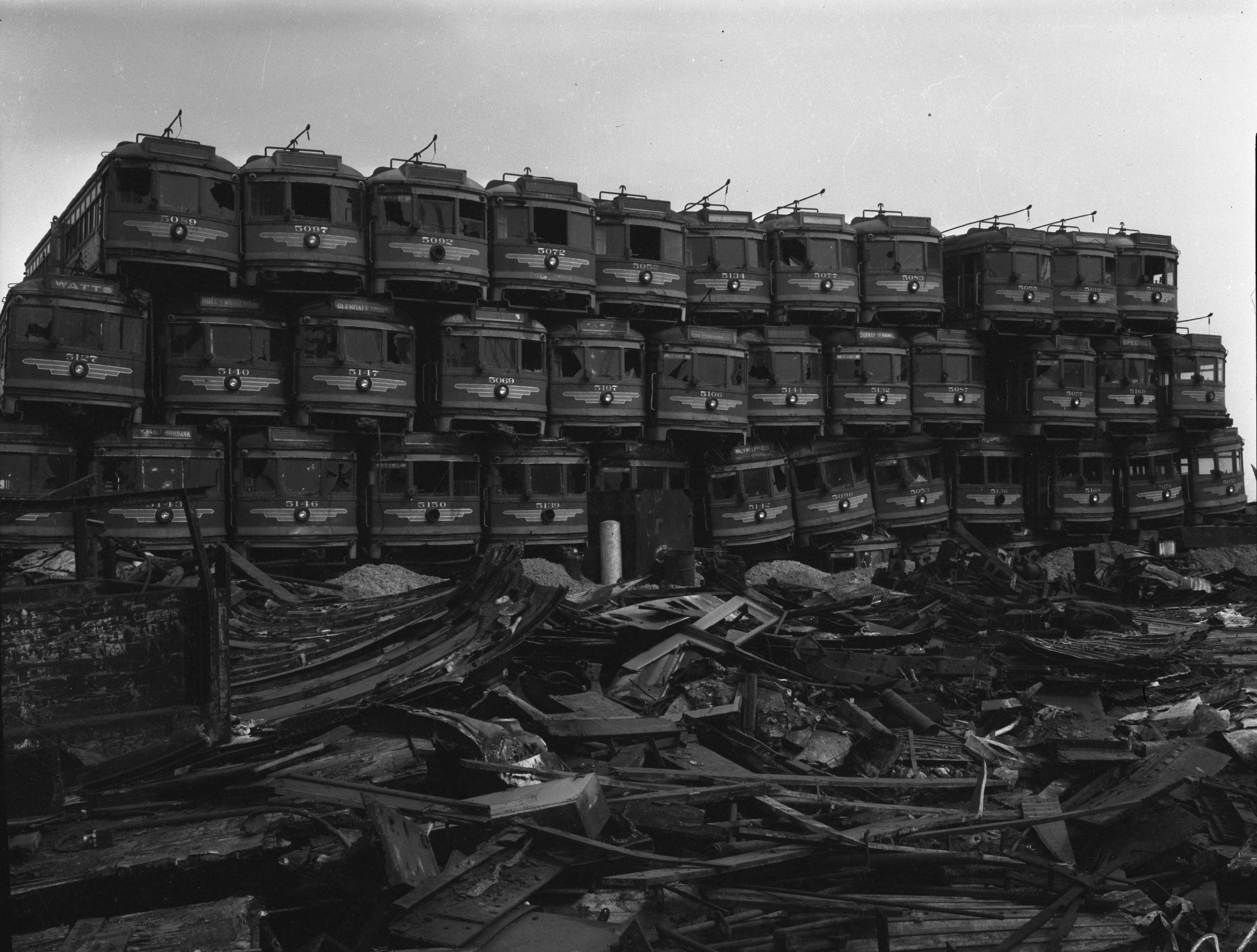 The federal highway program shifted resources away from public transportation and toward the construction of a massive interstate highway system. Dating back to the start of the twentieth century, Southern California’s Pacific Electric Railway, known as the Red Car system, used streetcars, light rail, and buses to carry passengers throughout the greater Los Angeles metropolitan area. But plans to modernize the Red Cars were overwhelmed by automobile lobbyists and public officials who envisioned a web of freeways throughout the region. Federal subsidies for the highway system tolled the death knell for the Red Car, which ceased operation in 1961. While most of the old cars were consigned to the scrap yard on the city’s Terminal Island, as shown here, some of them were shipped overseas for use in other countries’ public transportation systems.