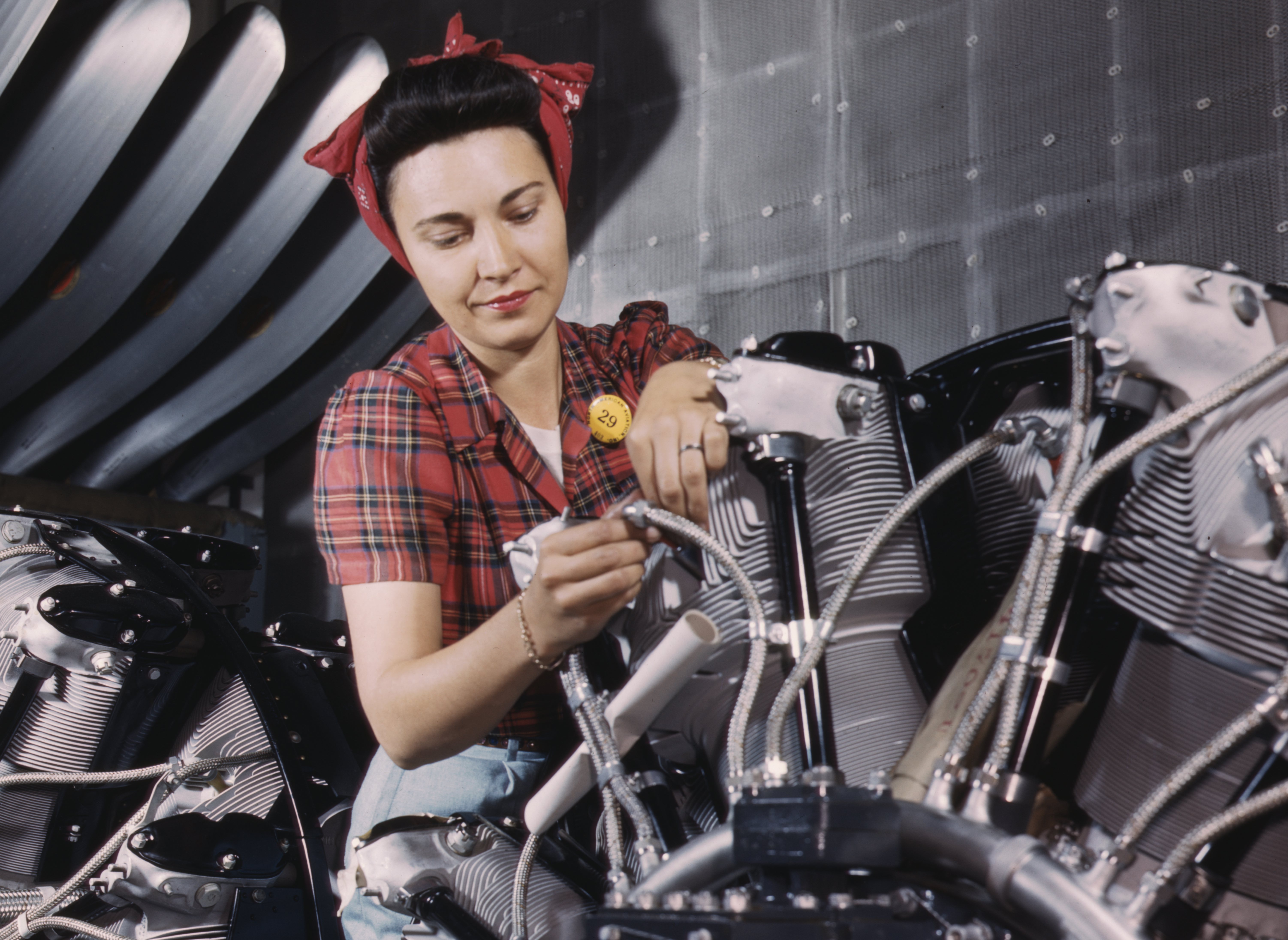 She now assembles airplanes, but her lipstick is still unsmeared. Once women were mobilized for the war effort, government propaganda photographs&nbsp;found it opportune to confer some romance on work that had previously been construed as neither romantic nor appropriate for women. This Office of War Information photograph&nbsp;imbued the new female industrial worker with the same kind of clean, unruffled glamour that&nbsp;had applied to women’s household work before the war.