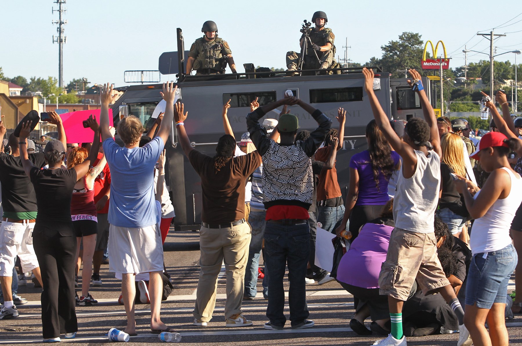 The murder of Michael Brown, a Black teenager, by a white police officer in Ferguson, Missouri, in August 2014 sparked weeks of protests in that predominantly African American suburban community. Even before the protests became widespread, the St. Louis County police response quickly took on the semblance of a military occupation, with camouflage-uniformed officers wearing body armor, bearing night-vision equipment, armed with high-powered automatic weaponry, and accompanied by armored vehicles. Such militarization of U.S. law enforcement was abetted by a Defense Department program that redistributed surplus military equipment to local police departments, much of it left over from the wars in Afghanistan and Iraq. Police reliance on aggressive, heavily armed domestic military hardware and tactics—from confronting political demonstrations to even more numerous drug raids on homes and businesses—increased civilian casualties and fatalities, especially in communities of color.